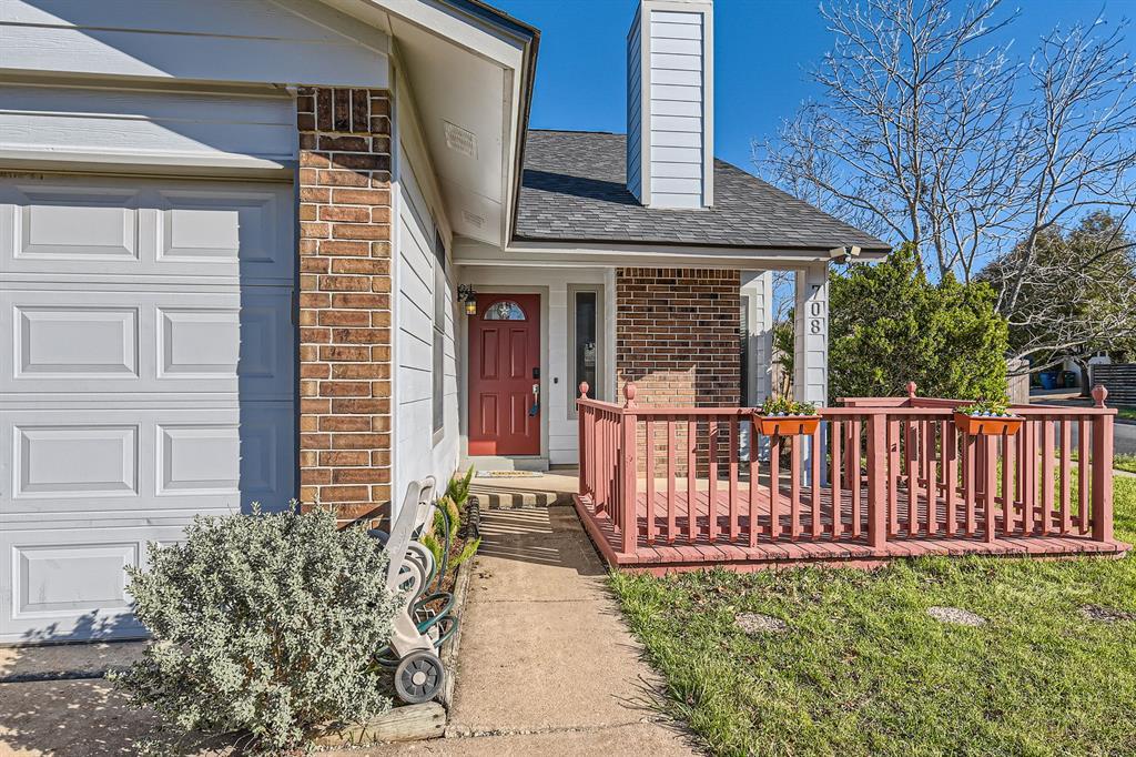 A welcoming front porch with classic wooden raili