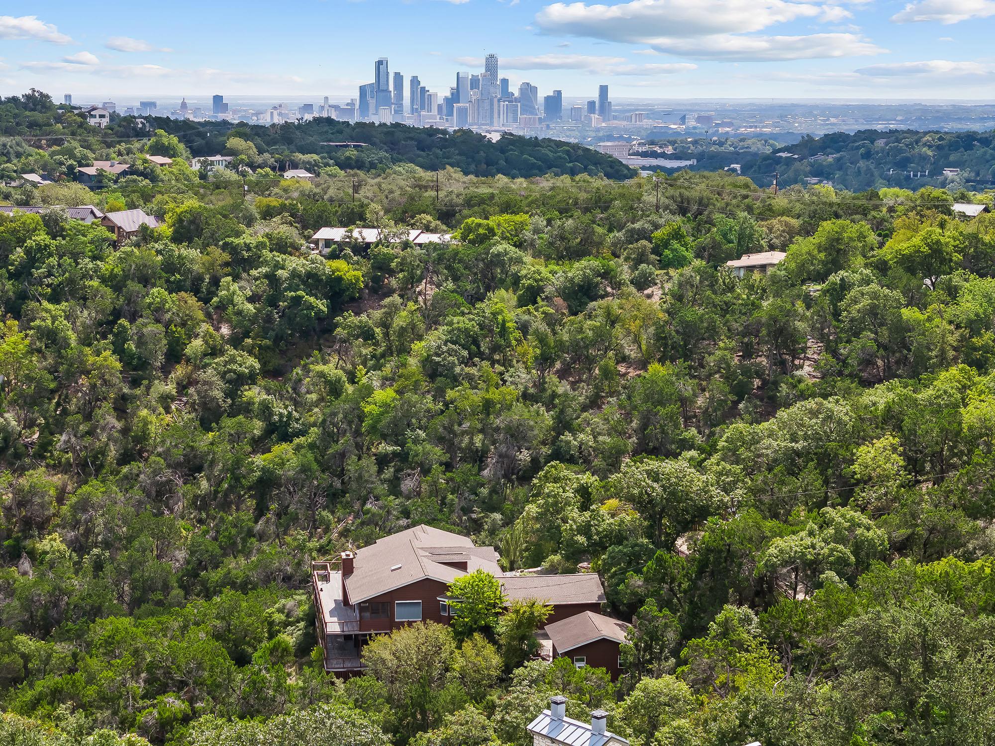 Lush wooded hillsides surround private residences