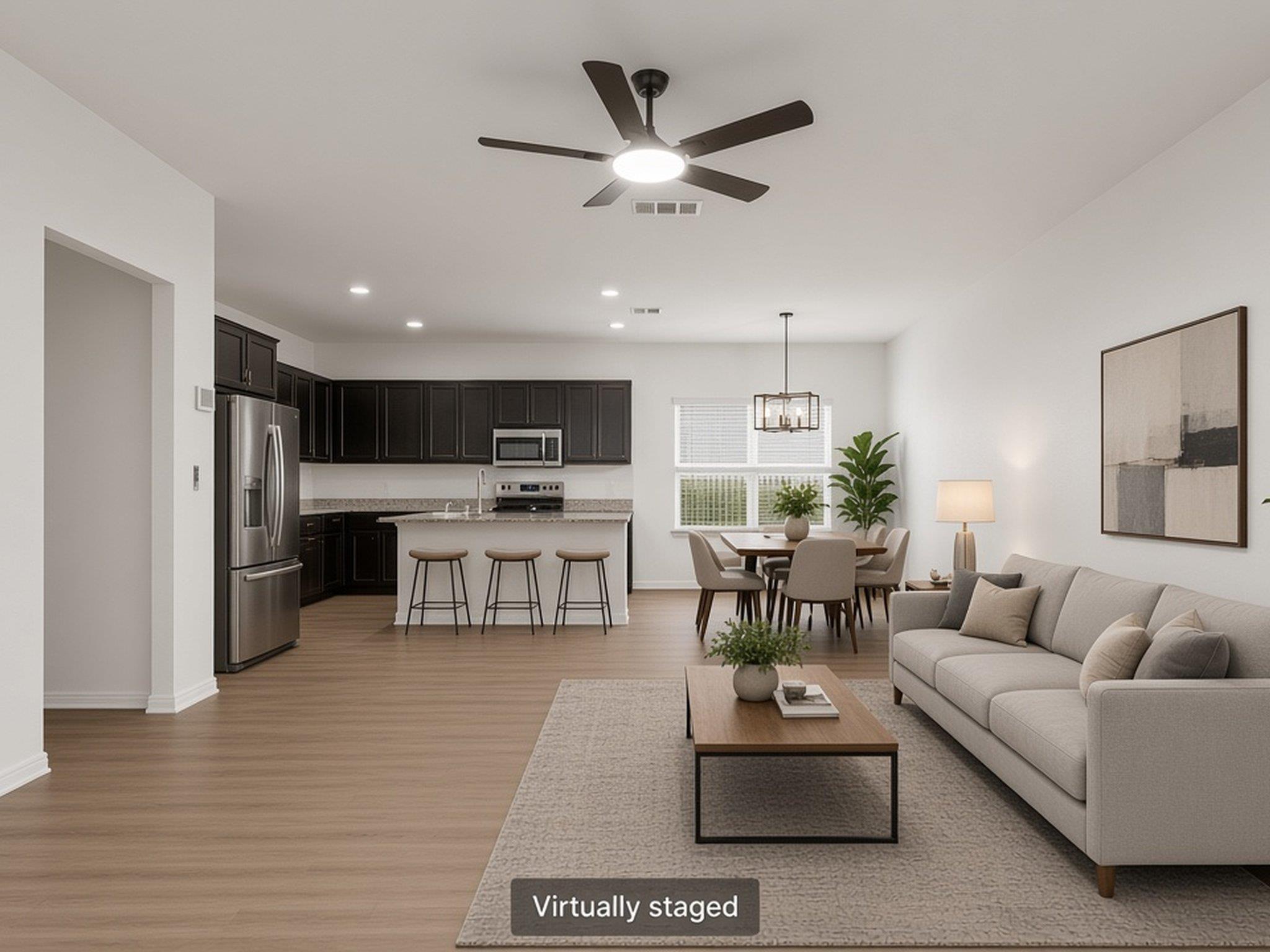 An open concept floor plan seamlessly connects th