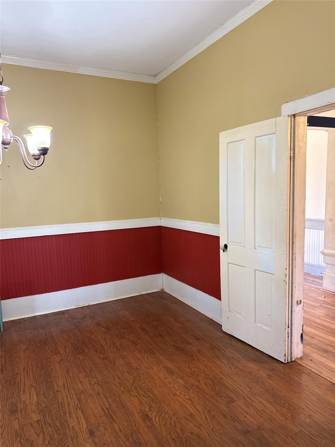 Rich hardwood flooring complements classic beadbo