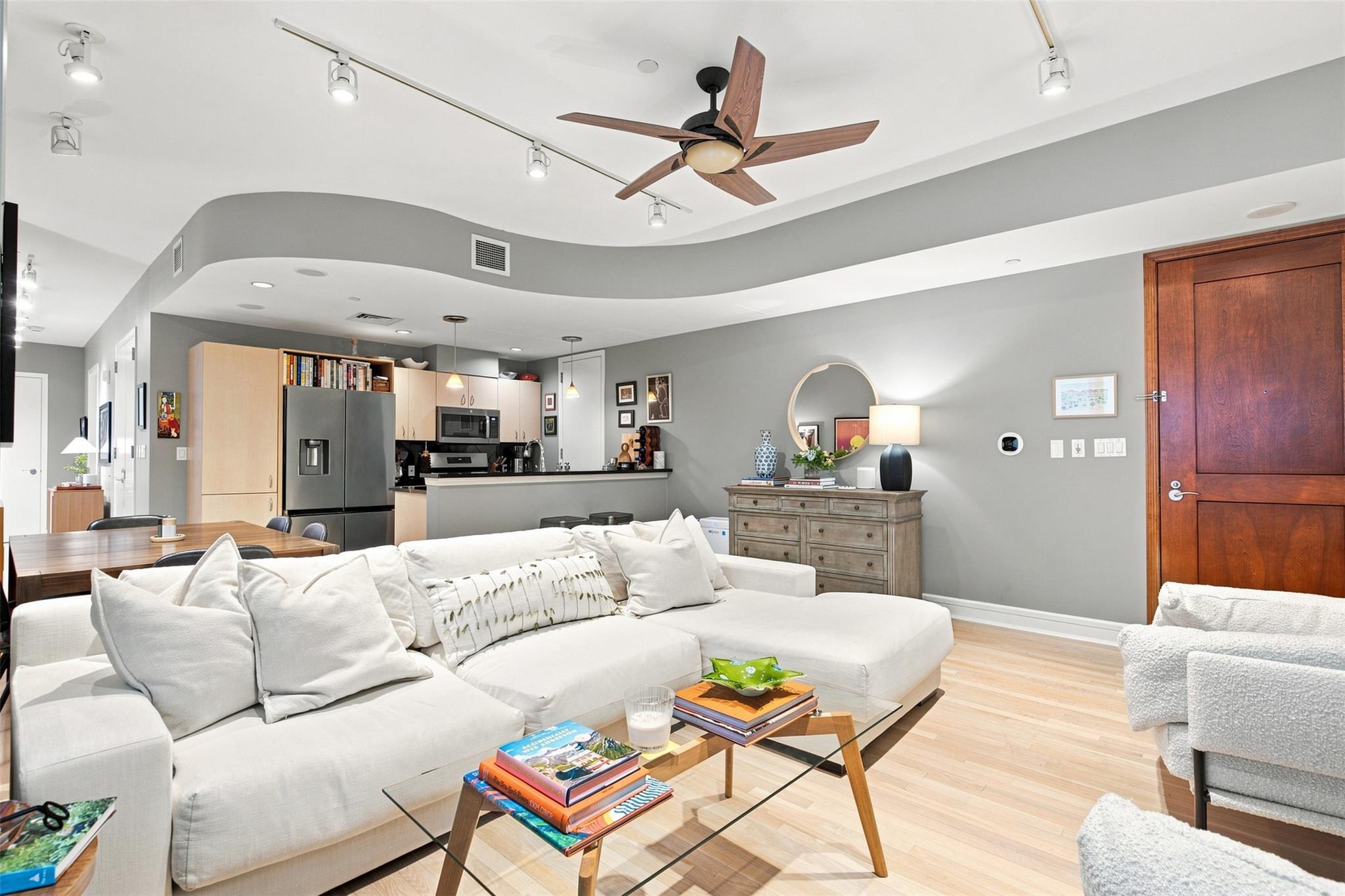 Gleaming hardwood floors and a modern curved bulk