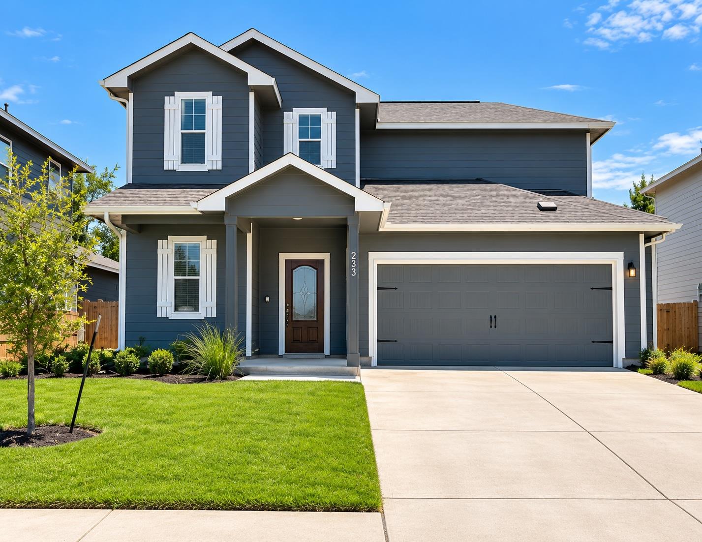 A spacious two-story elevation showcases neat lan