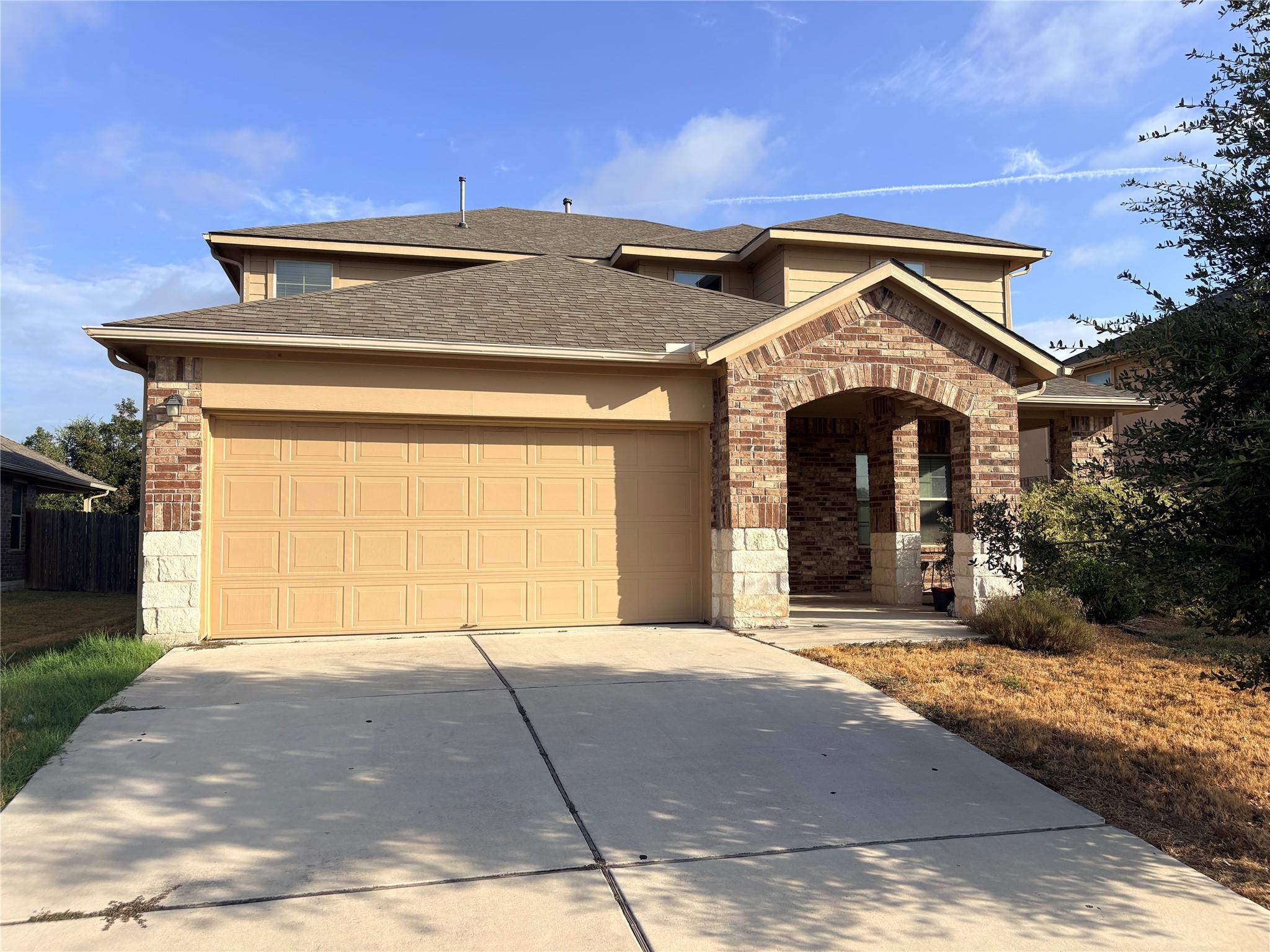 A spacious driveway leads to this multi-level hom