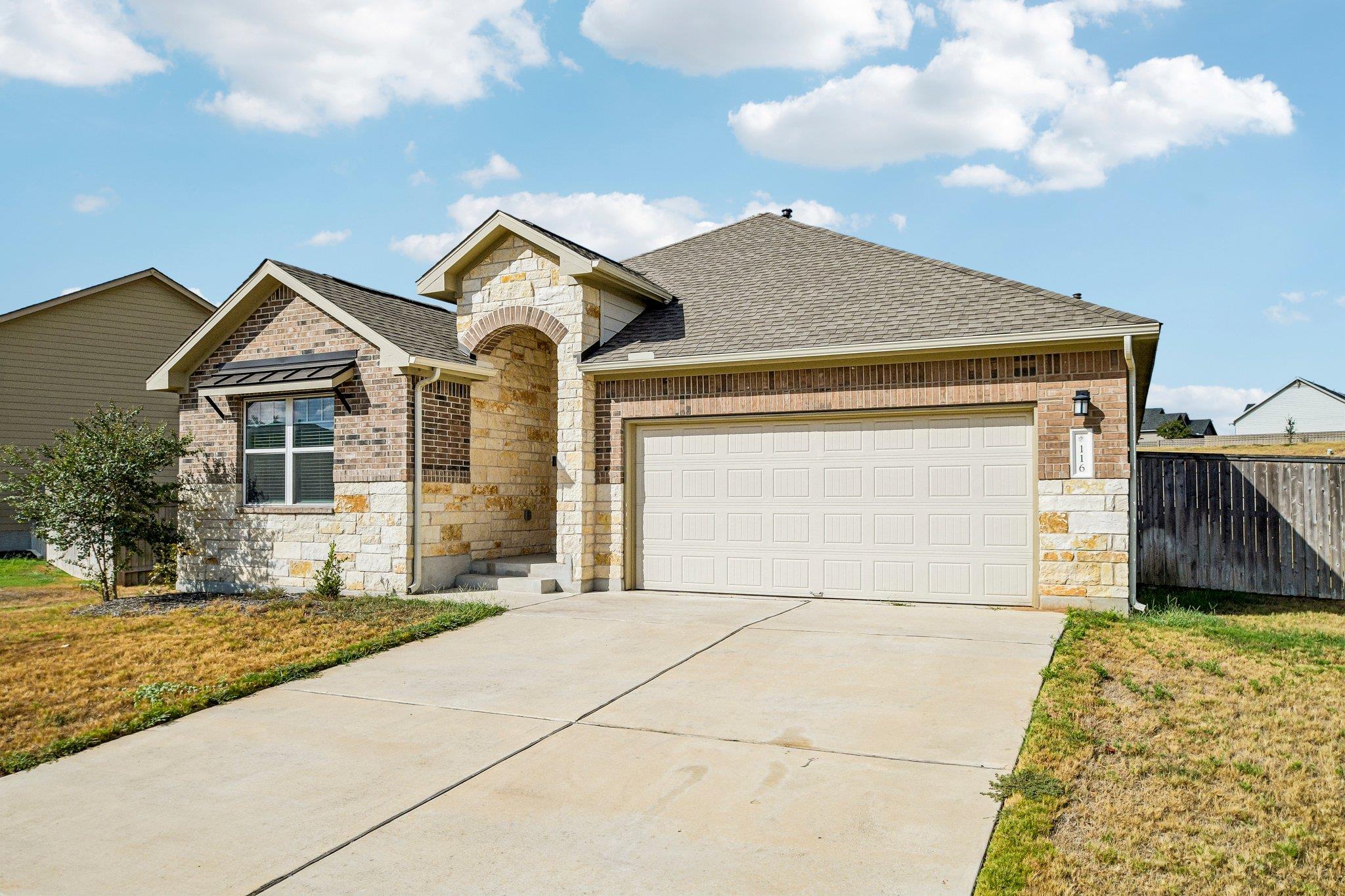 A classic brick and stone facade creates timeless
