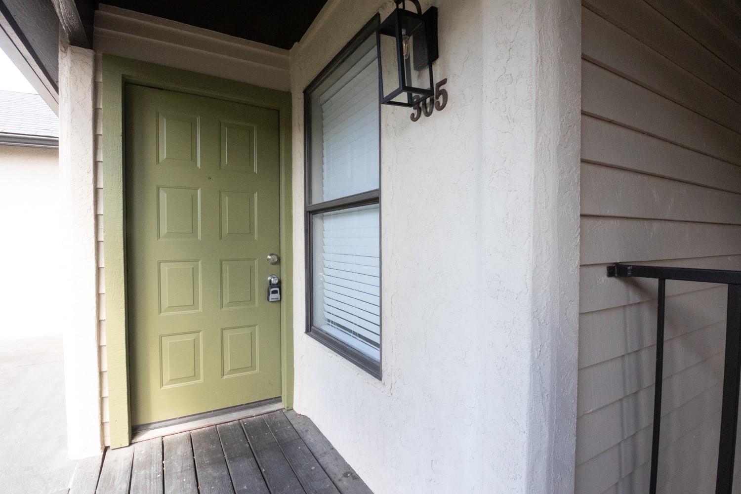 Welcoming front entrance features a classic panel