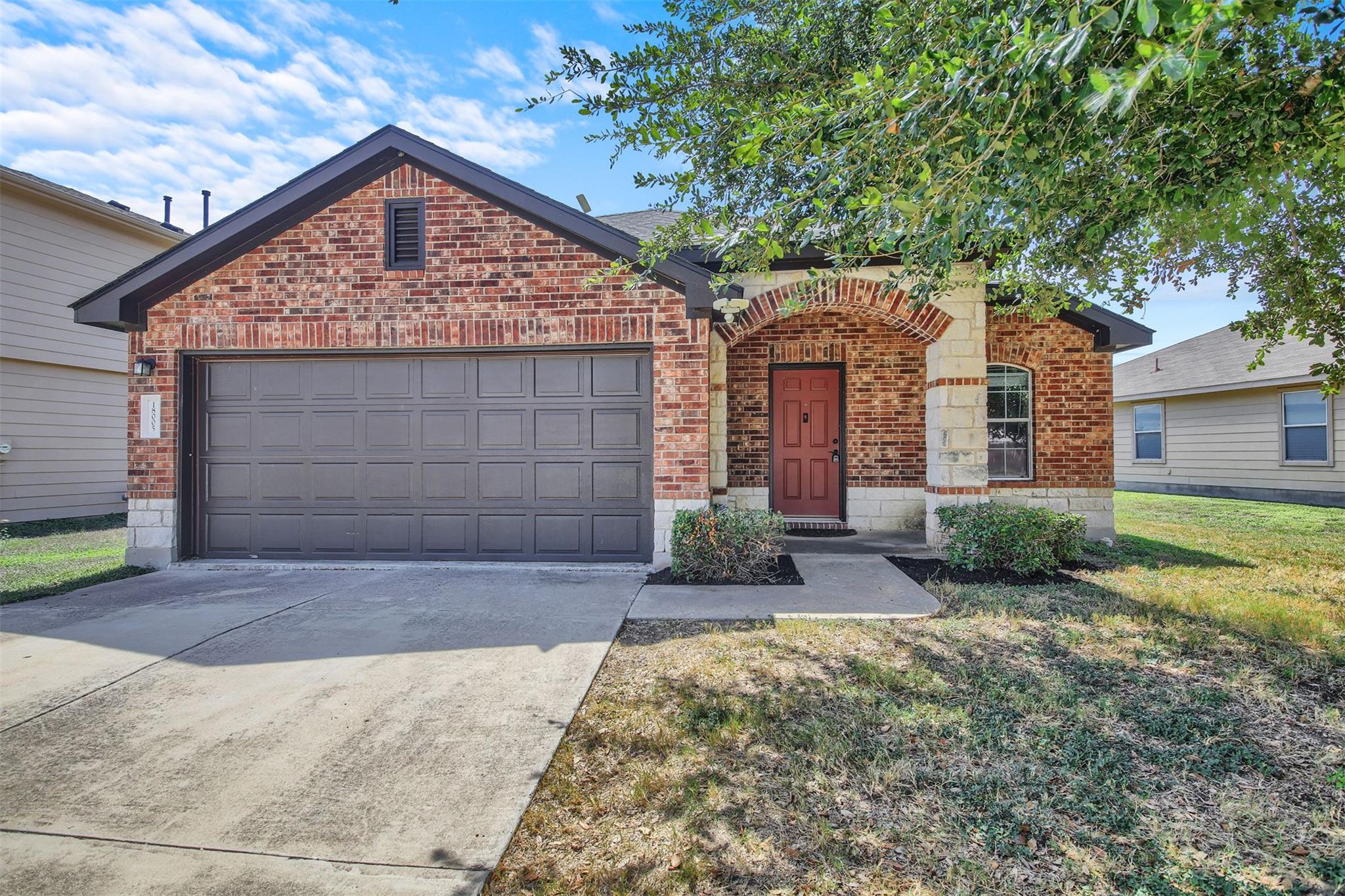 Classic brick craftsmanship accents this welcomin