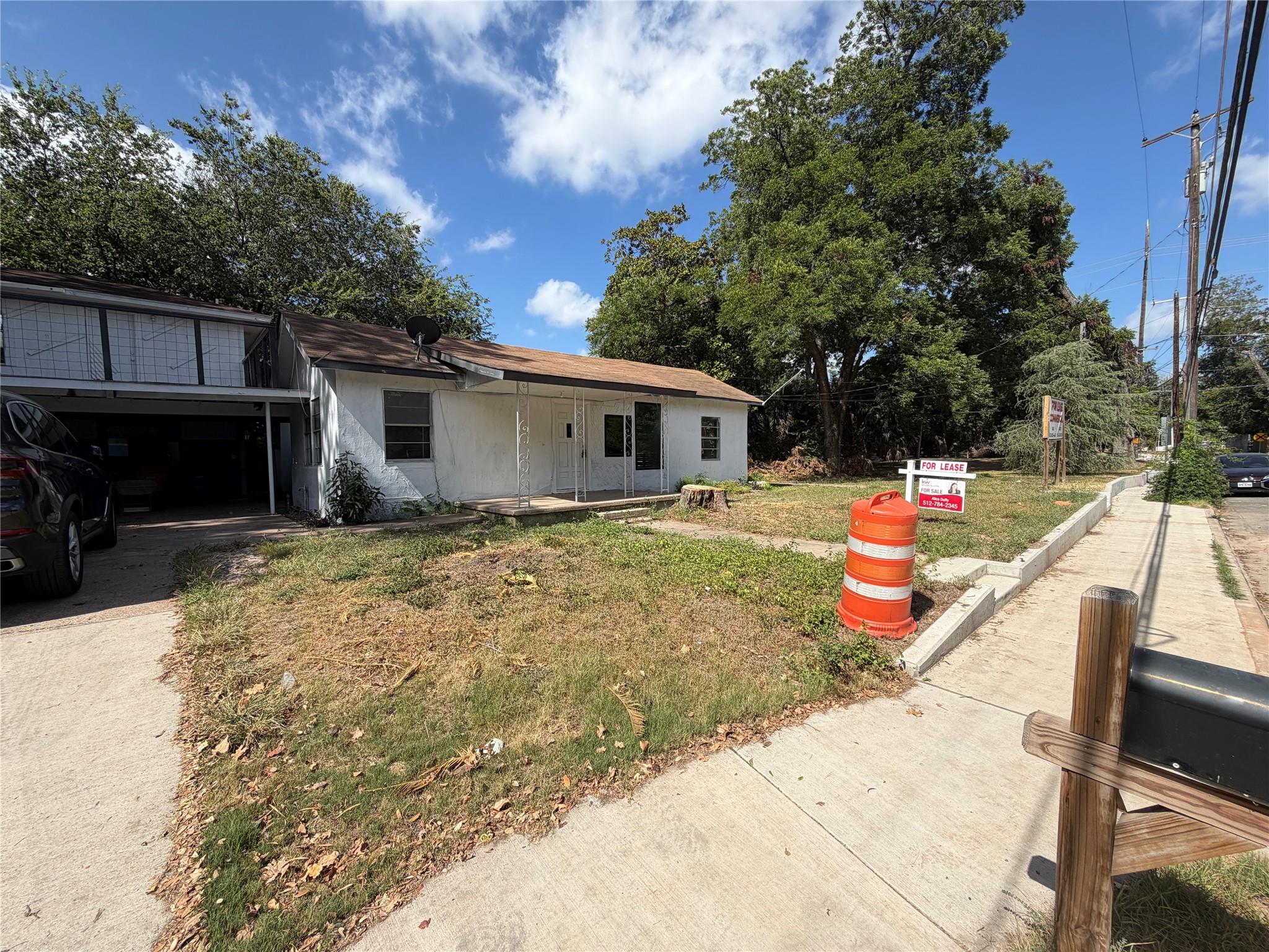 A classic single-story exterior features an attac