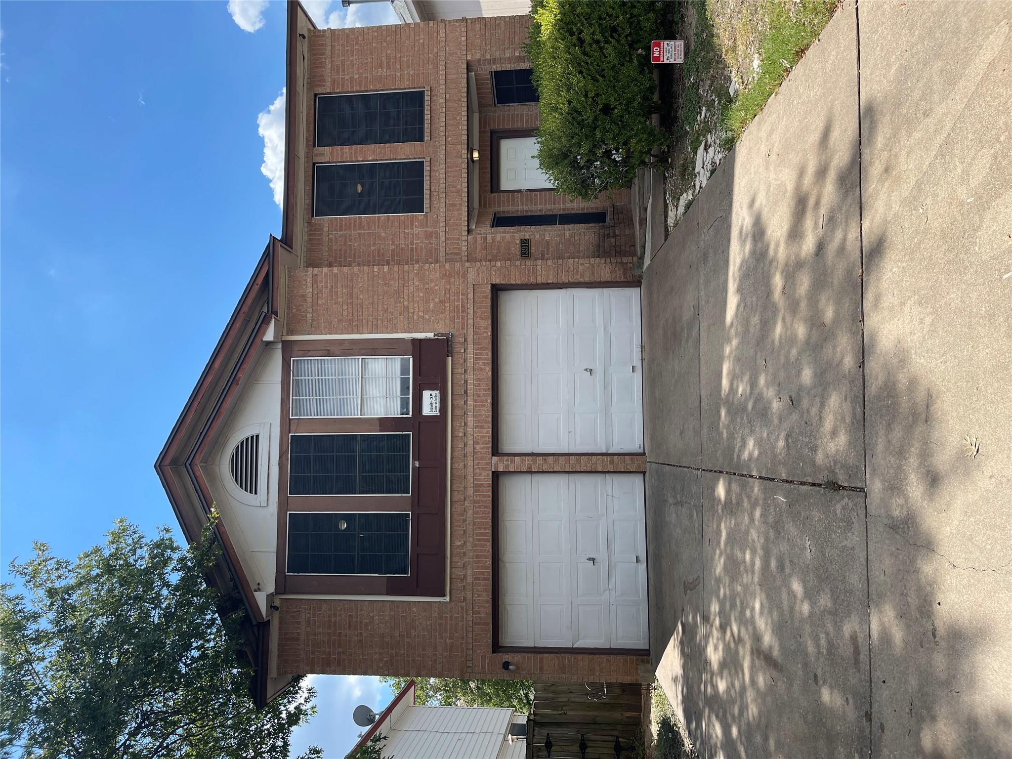 Classic brick exterior showcases an attached two-