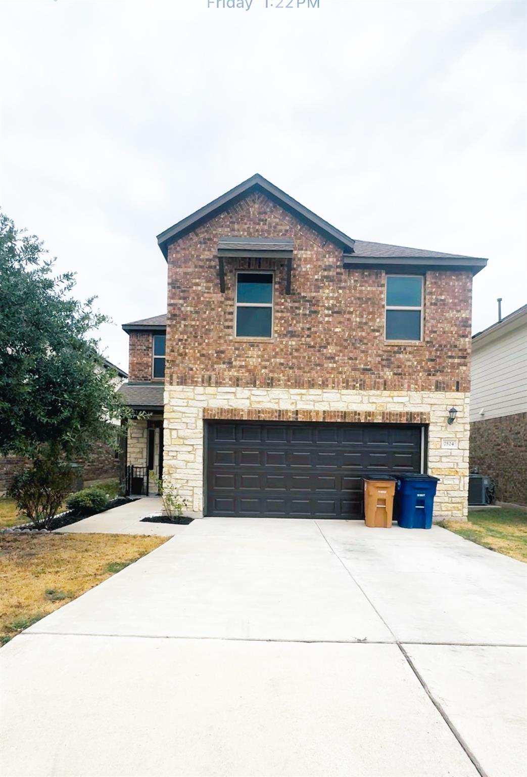 Brick and stone accents elevate the exterior of t