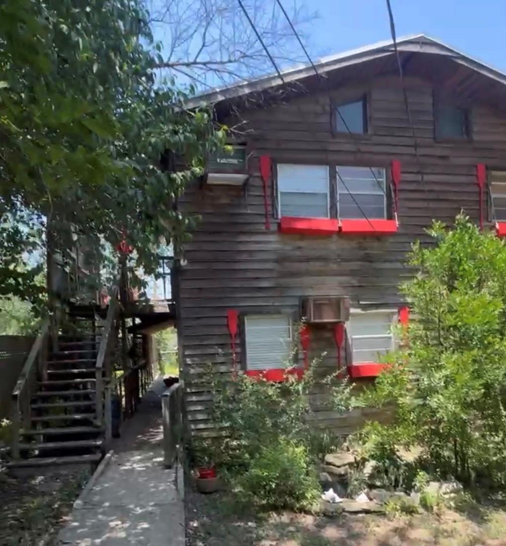 Rustic wood siding and private outdoor stairs def
