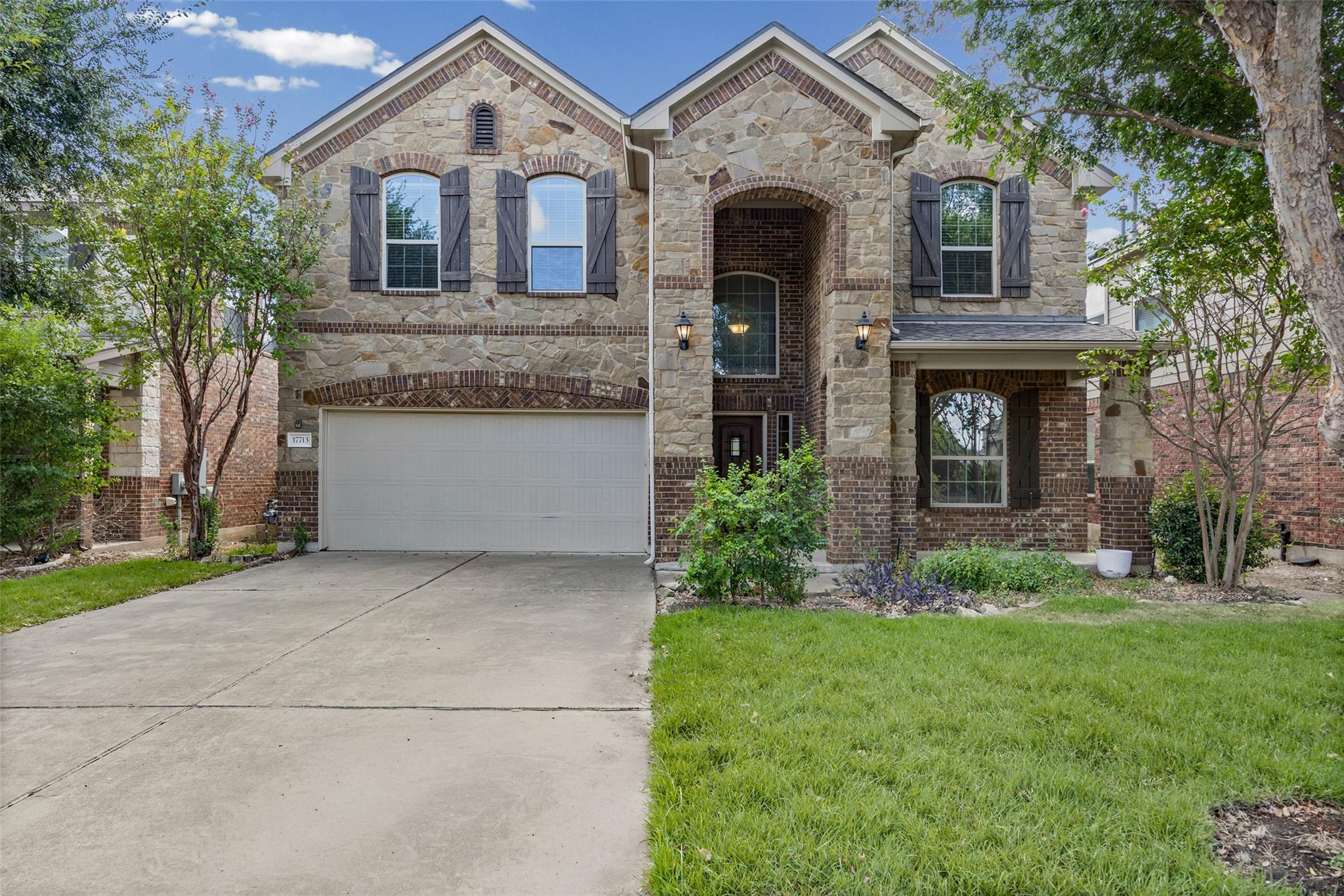 A grand stone and brick facade frames this elegan