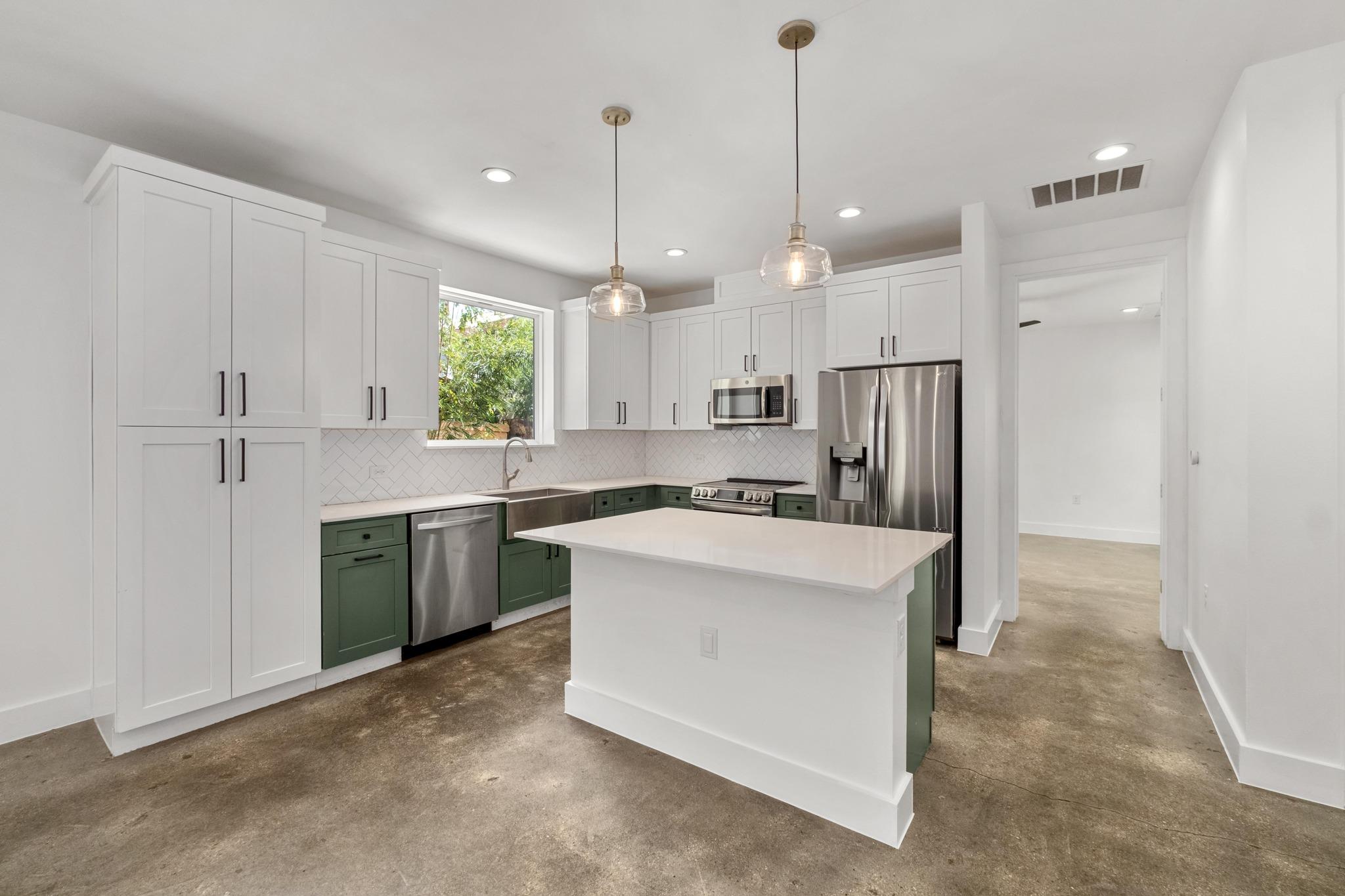 Industrial style concrete flooring grounds this m