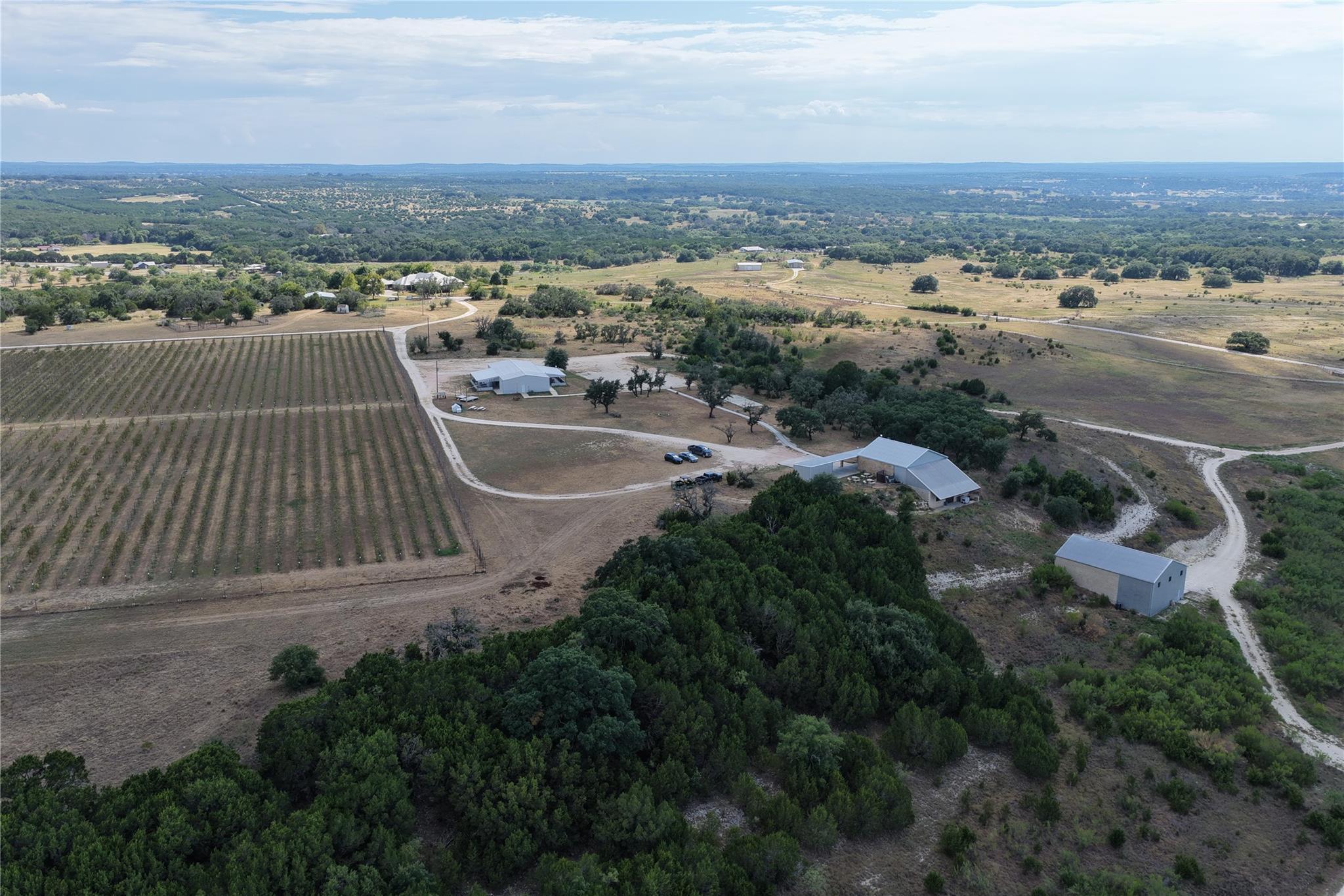 An aerial perspective showcases a vast rural esta