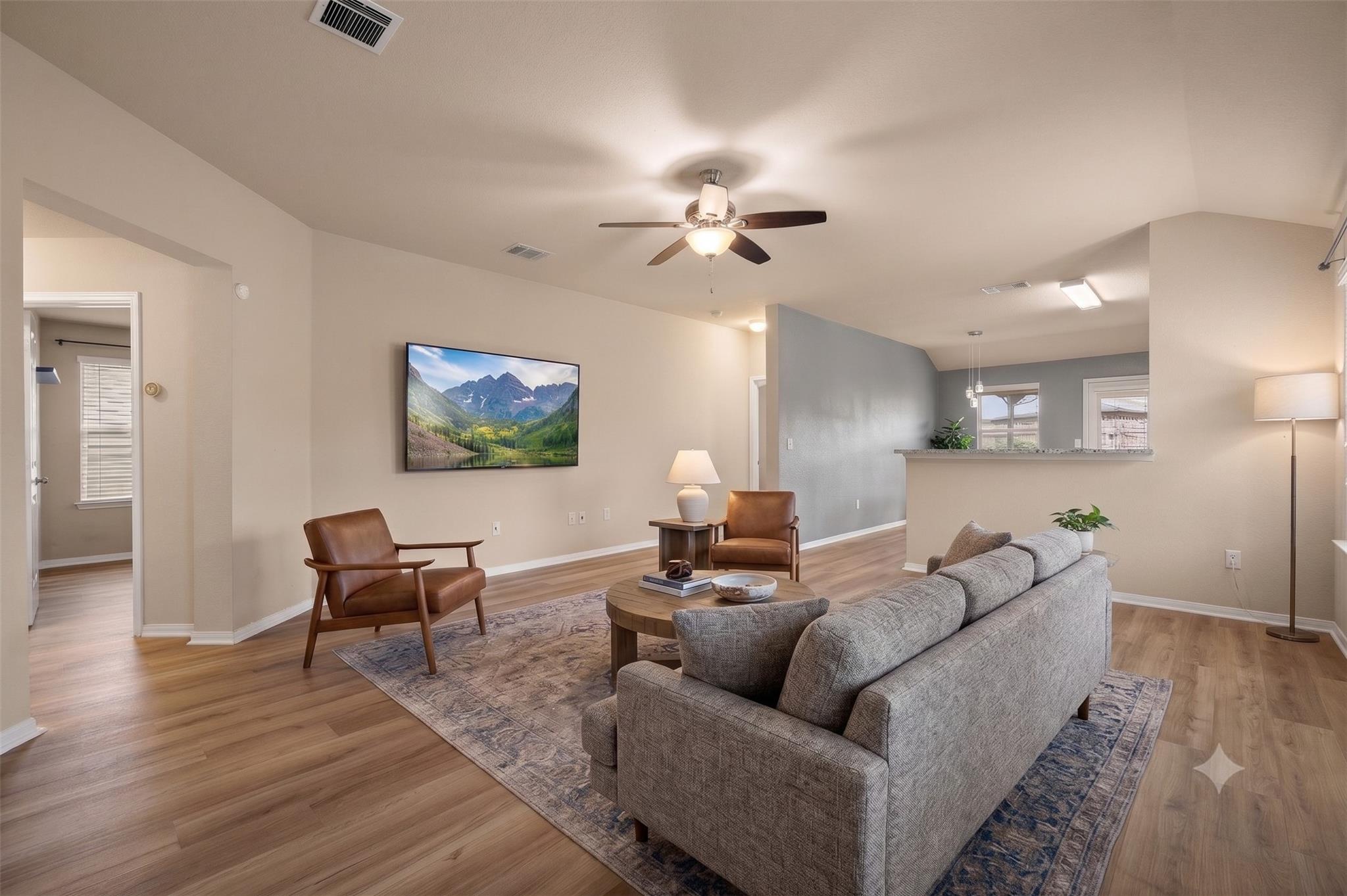 Natural wood-look flooring and an open layout def