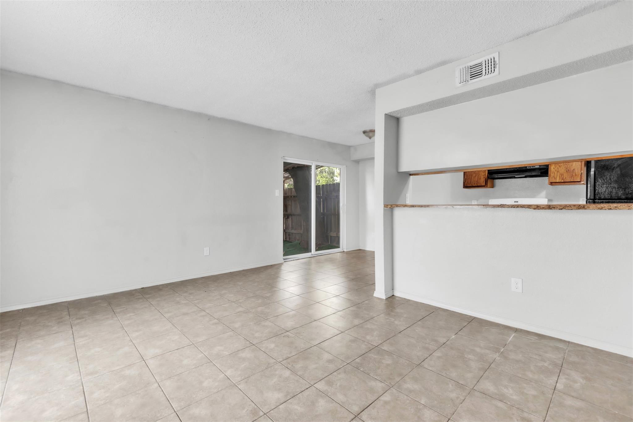 Ceramic tile floors anchor this versatile living 