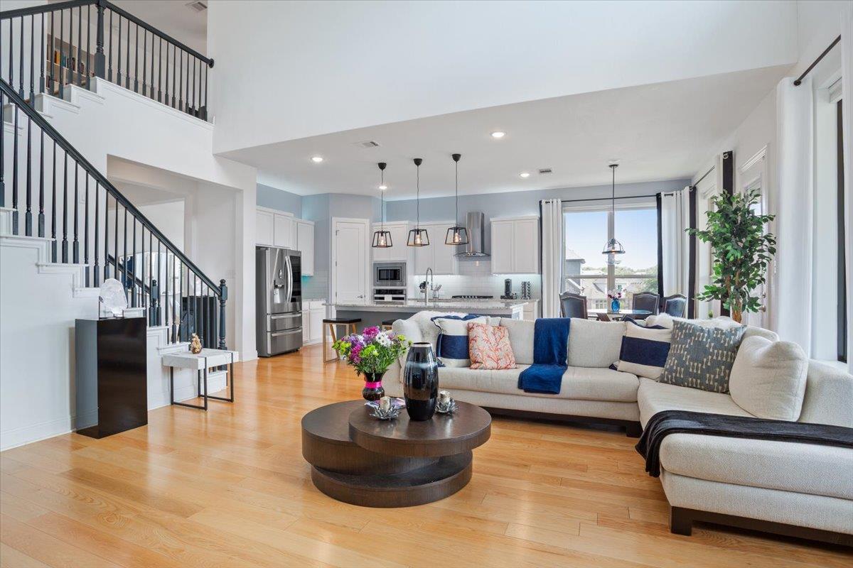 Hardwood floors and soaring ceilings define this 