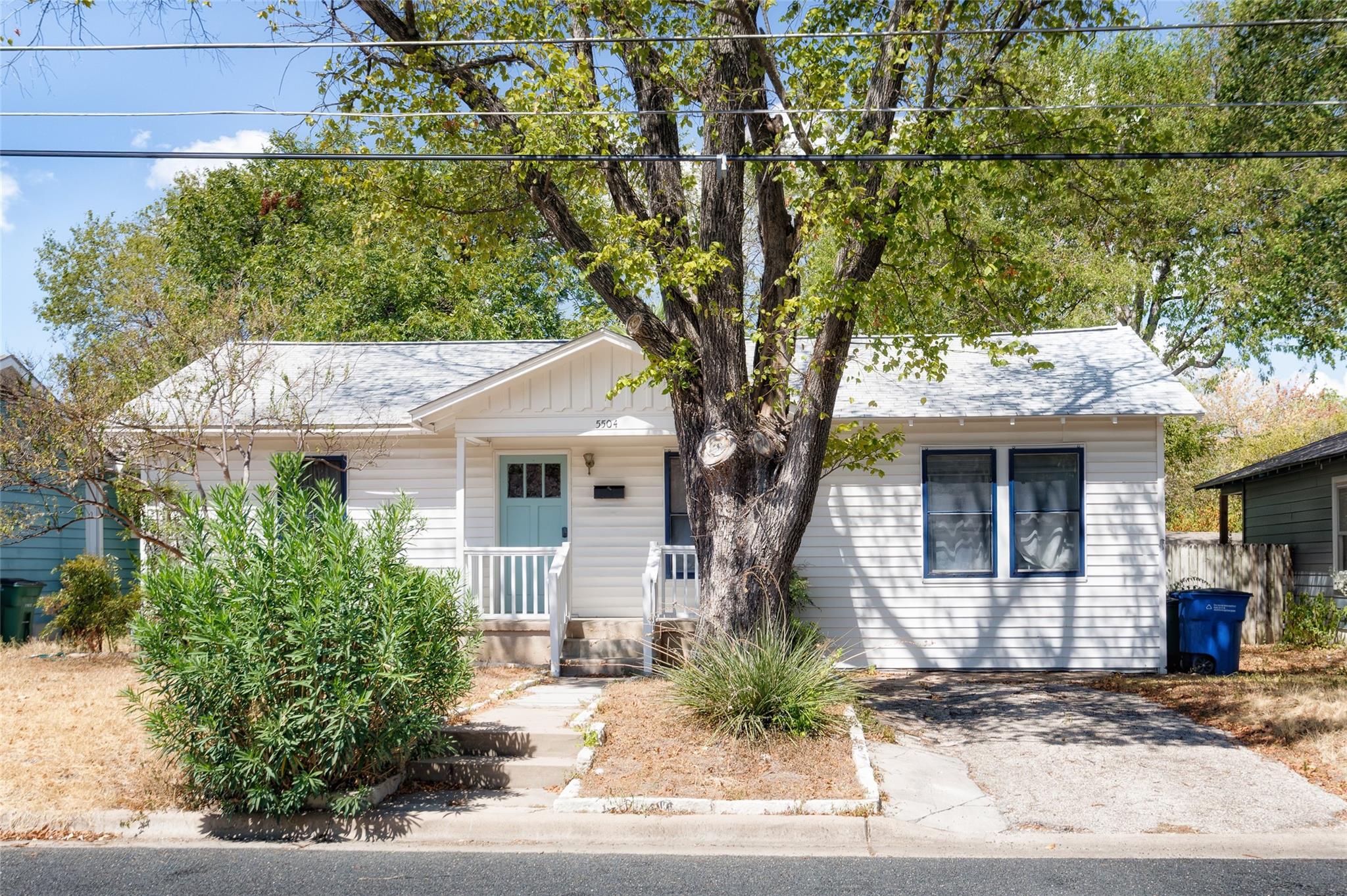 Mature trees frame the classic facade of this cha