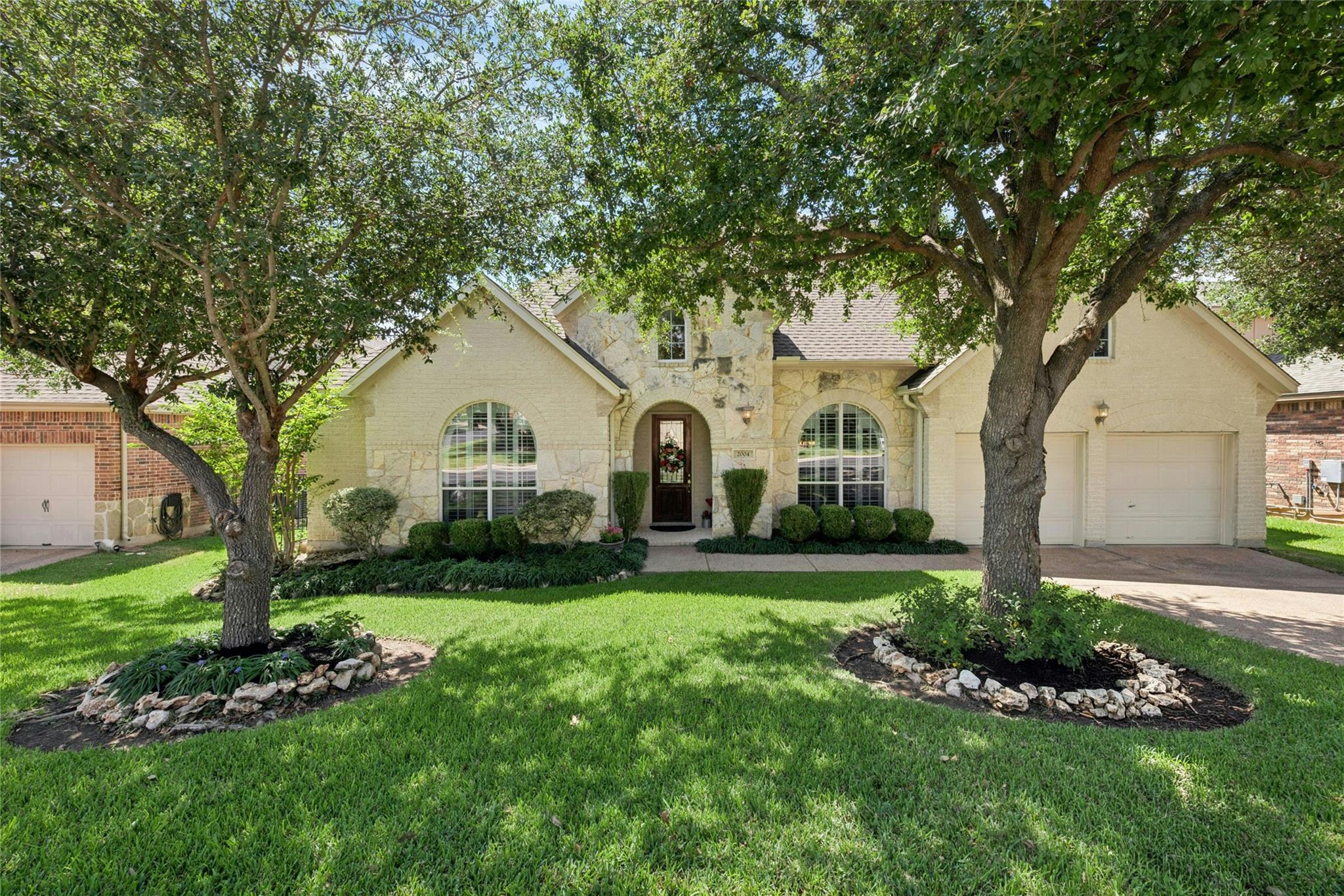 Mature shade trees and professional landscaping f