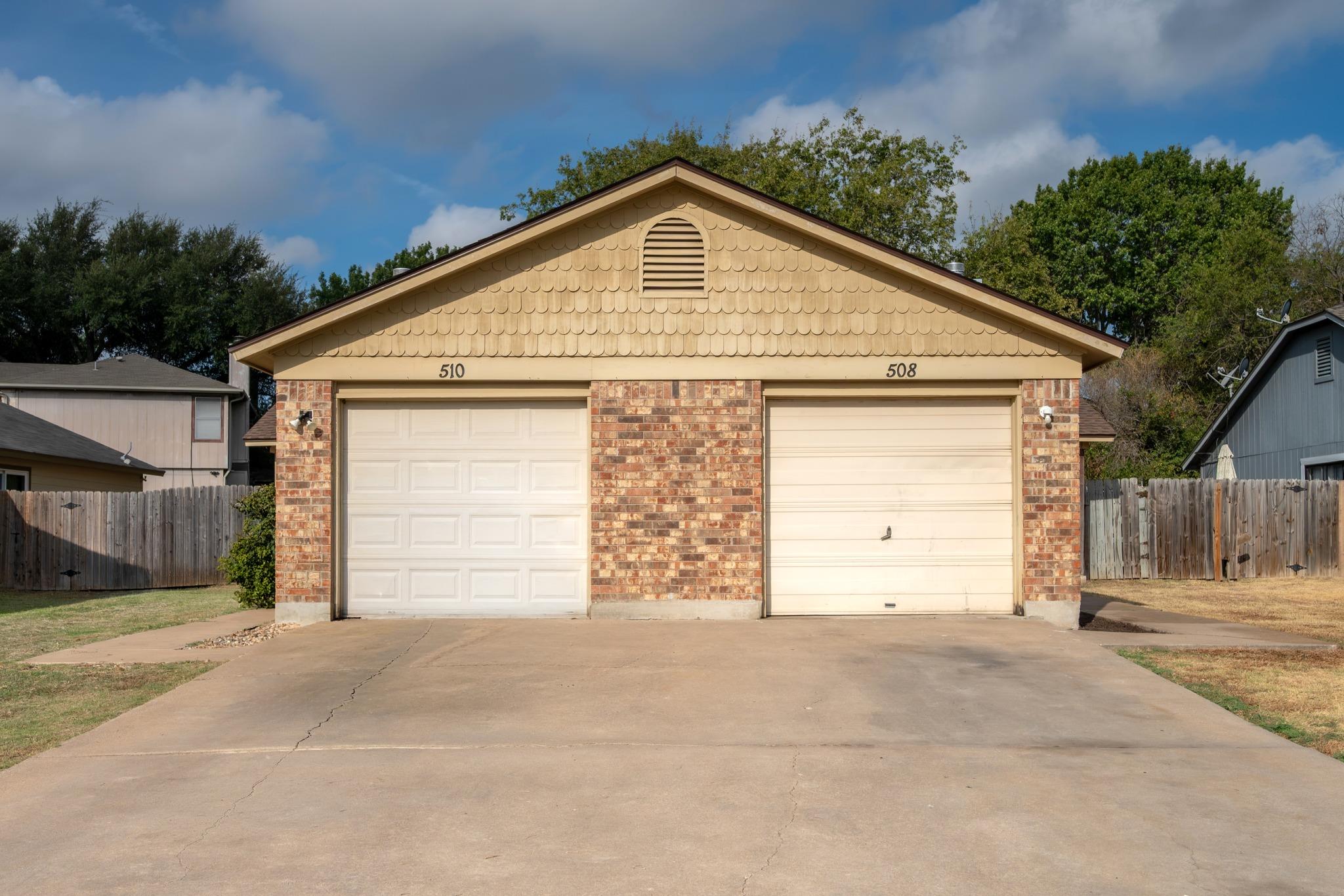 Brick detailing and classic shingle accents frame