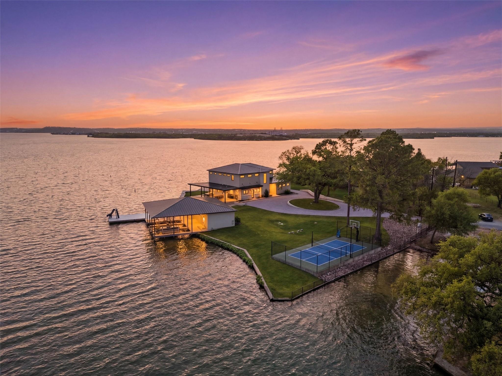 A private waterfront peninsula hosts this contemp