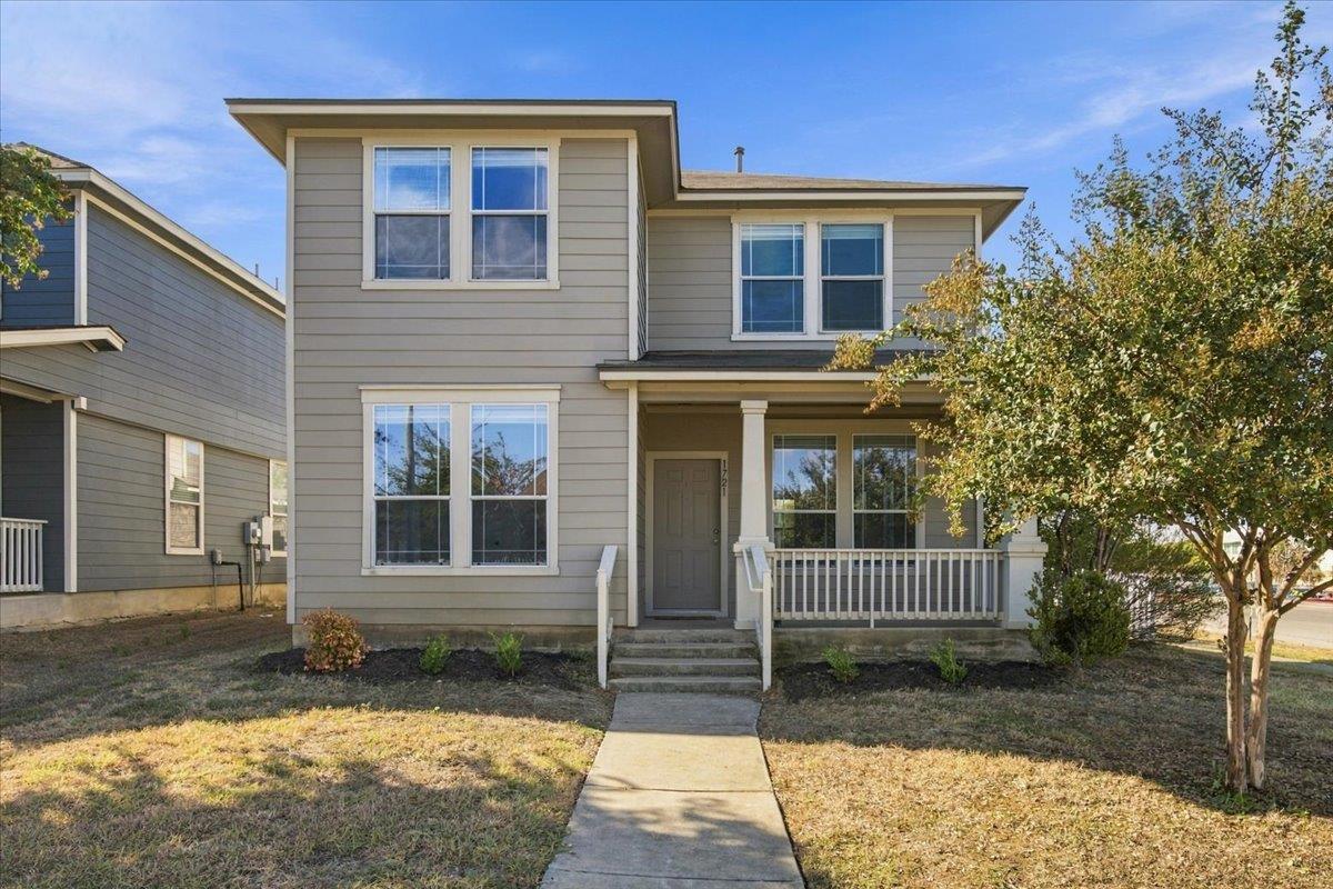 Clean lines and a welcoming front porch define th