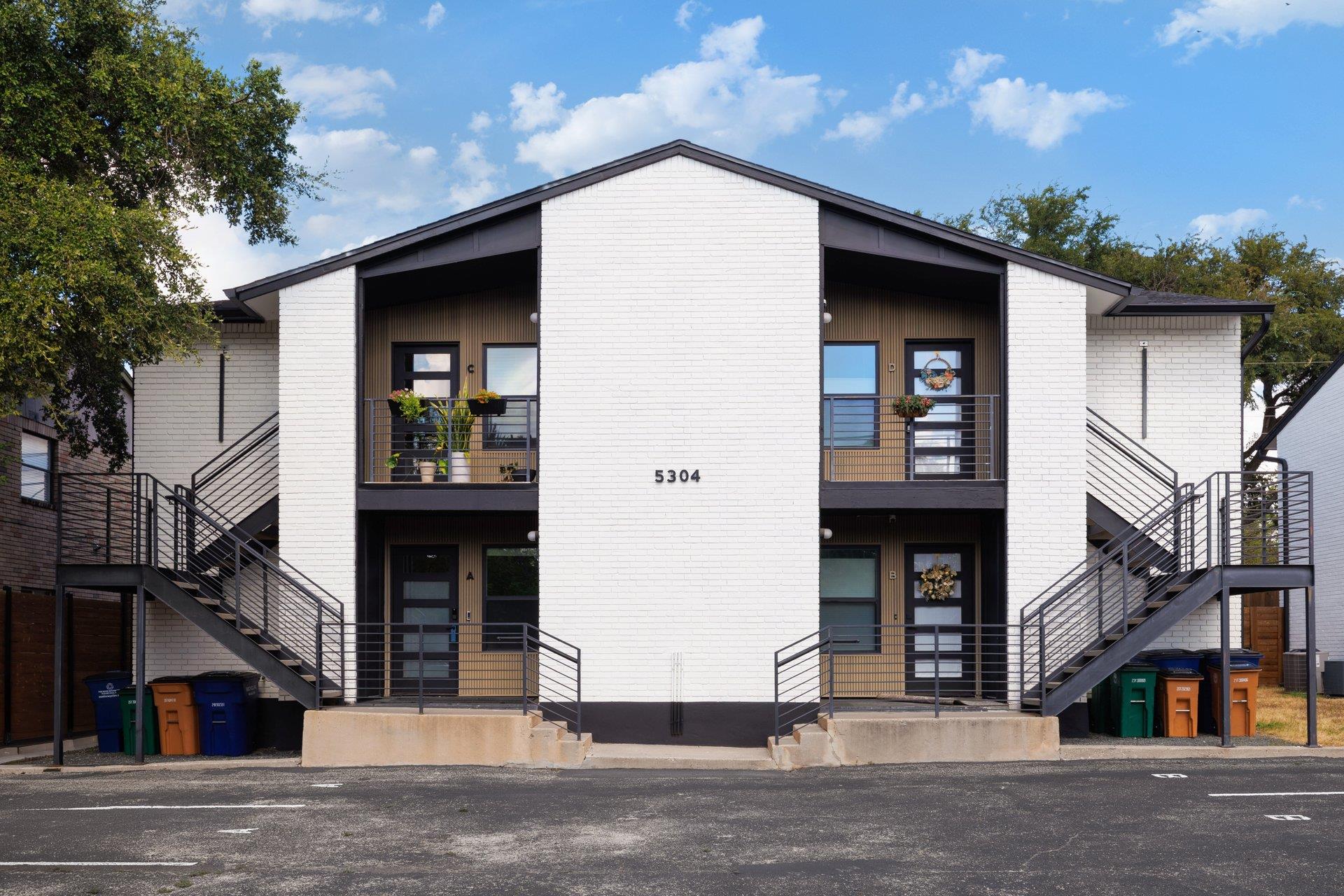 Symmetrical modern exterior showcases painted bri
