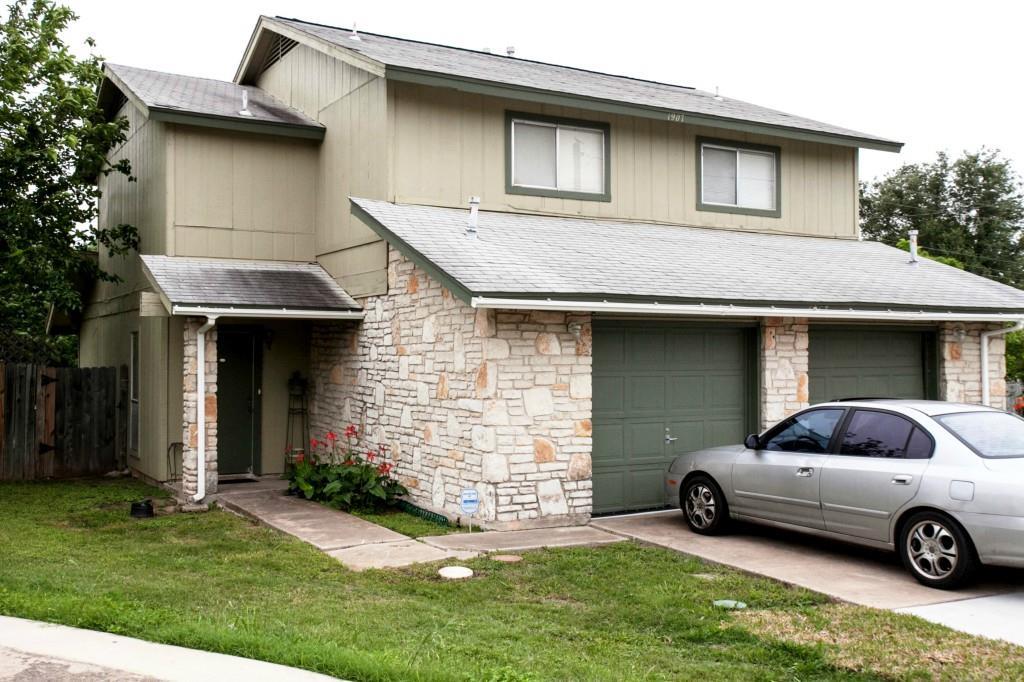 A stone veneer accent wall enhances the exterior 