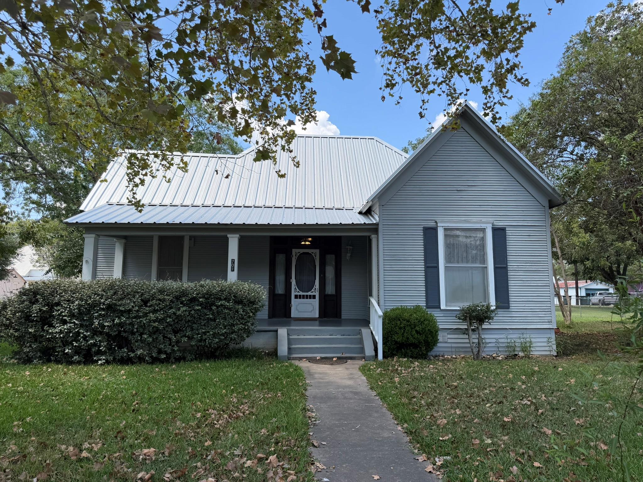 A classic front porch welcomes visitors to this c