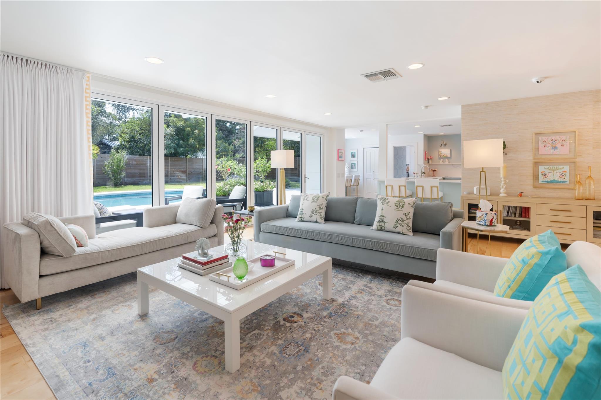 Walls of sliding glass doors seamlessly connect t