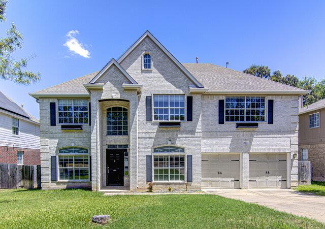Classical brick architecture defines this two-sto