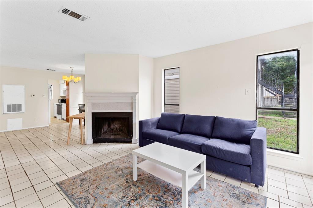 Tiled flooring and a classic wood-burning firepla
