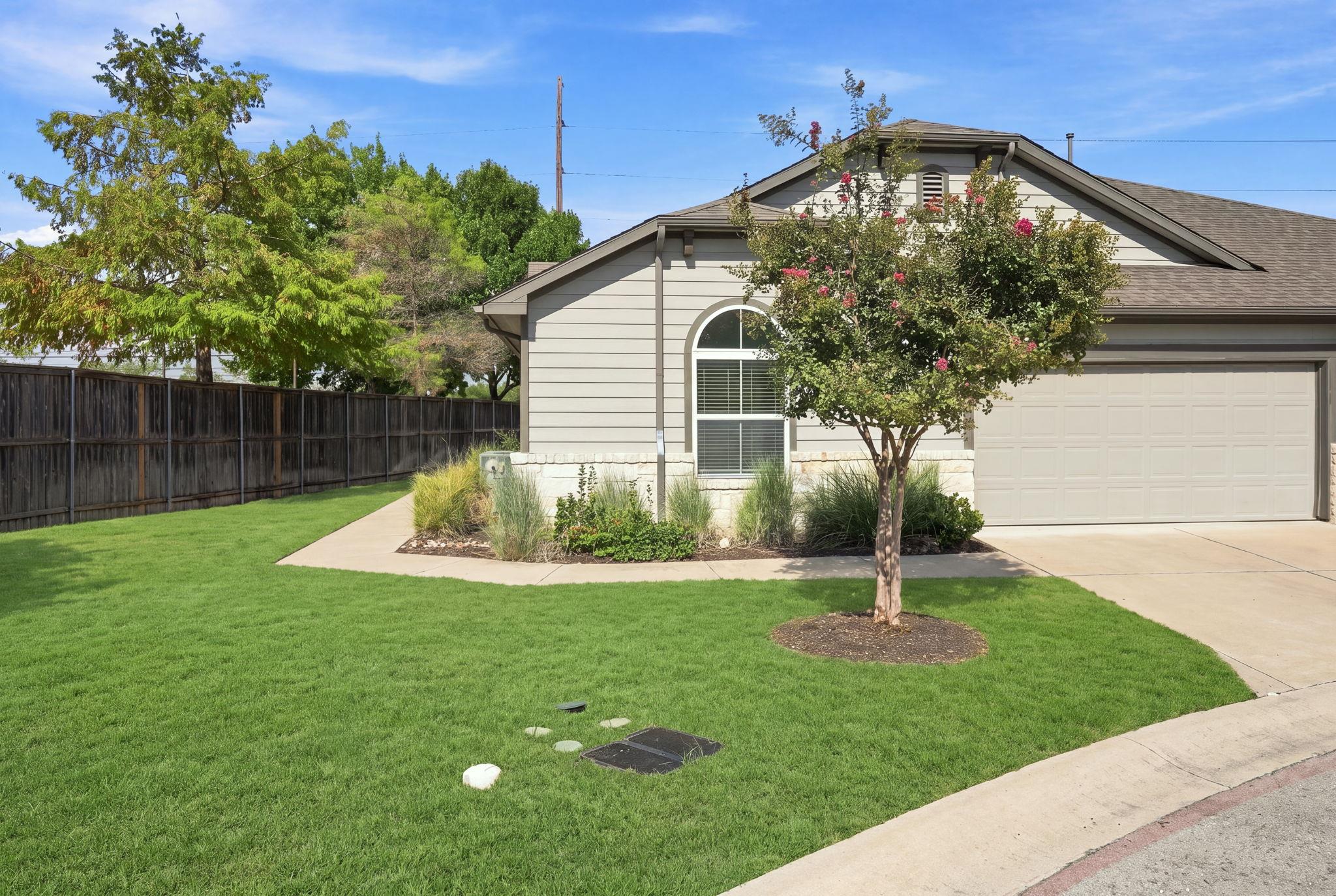 Manicured green turf frames a welcoming exterior 