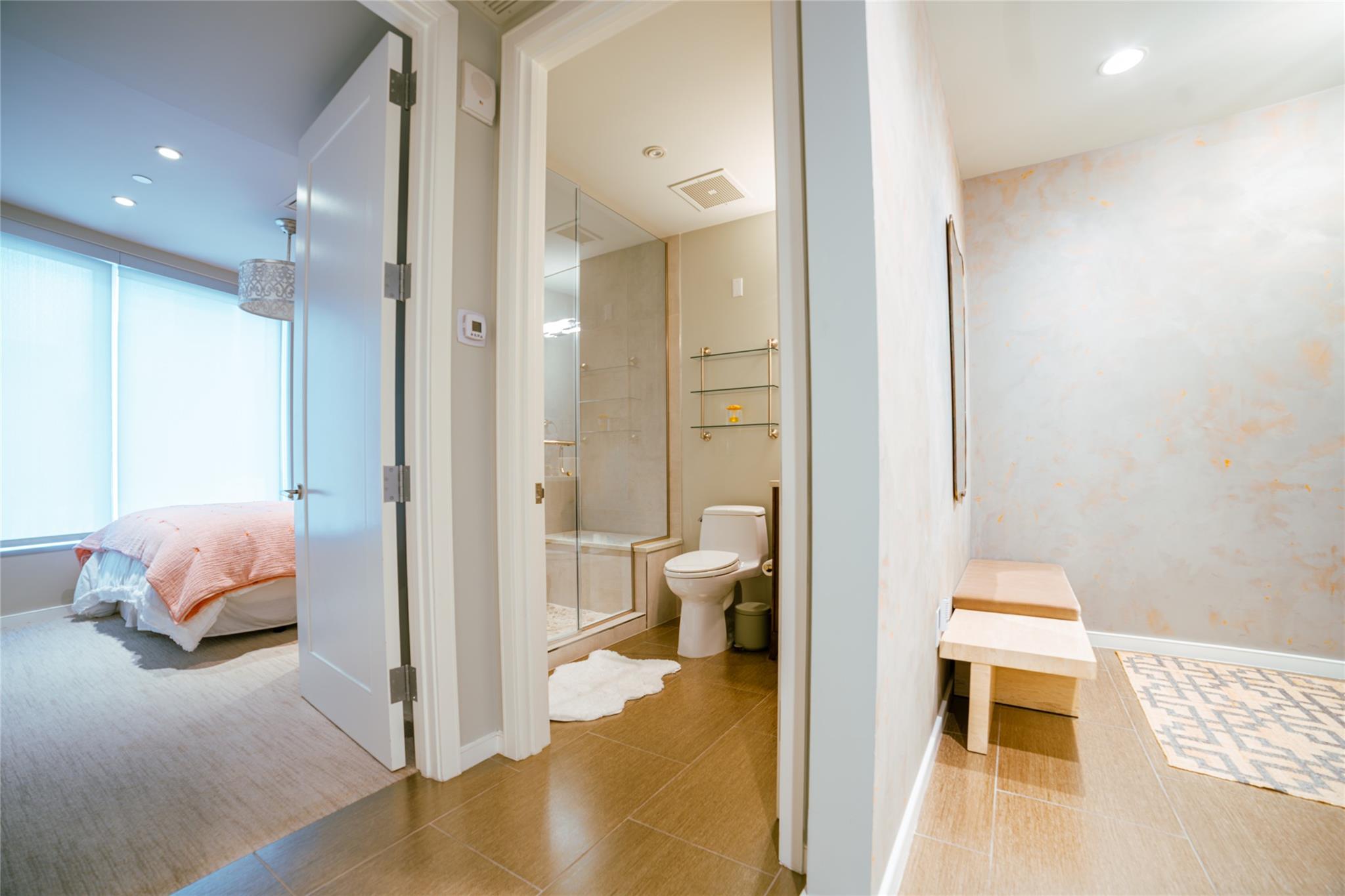 Full bath featuring connected bathroom, a shower 