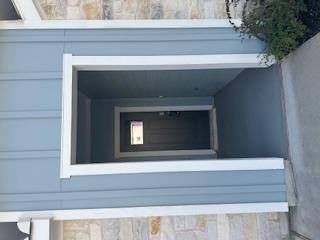 Crisp white trim frames a welcoming recessed entr