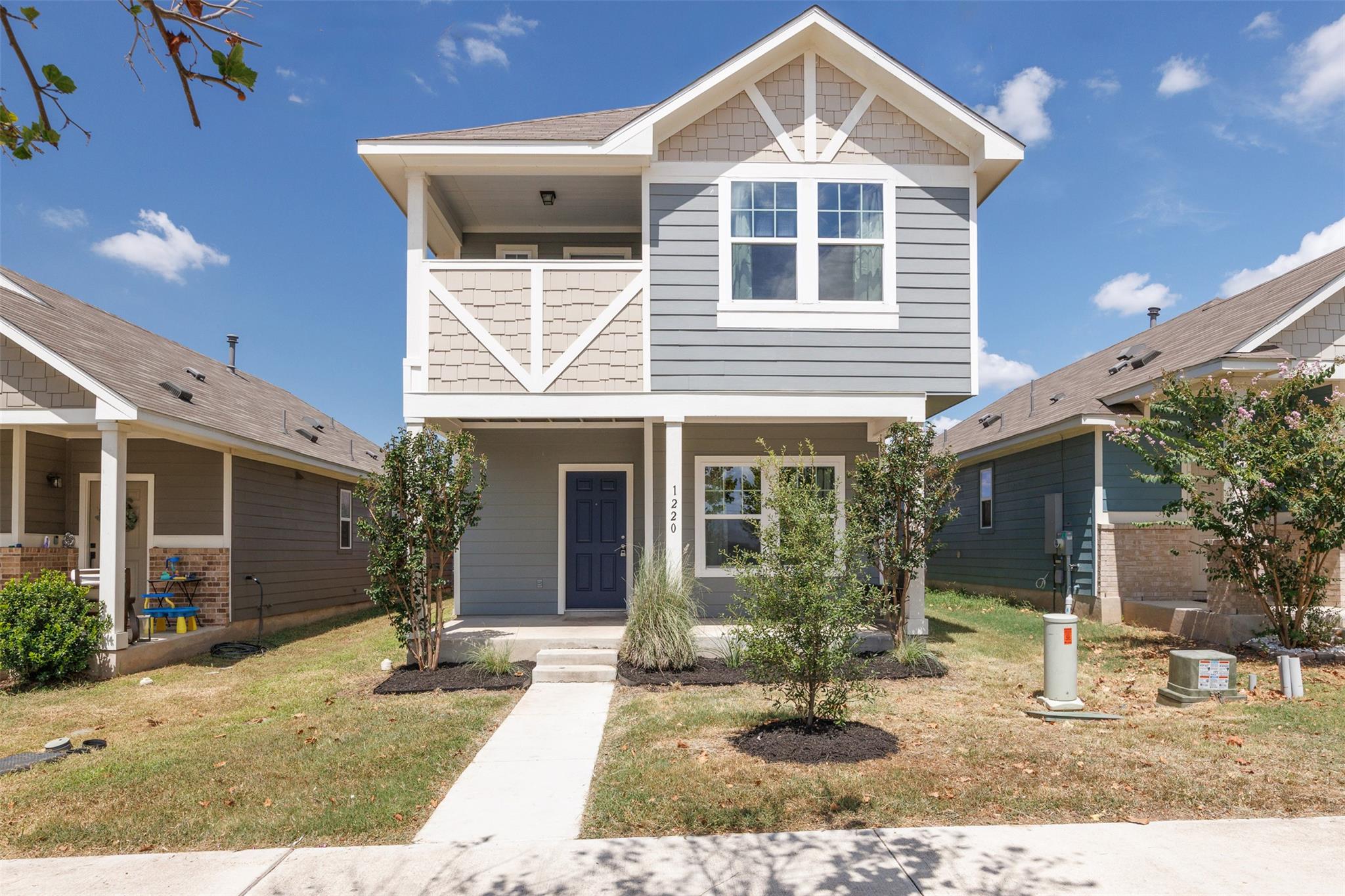 A welcoming front porch and crisp siding design e