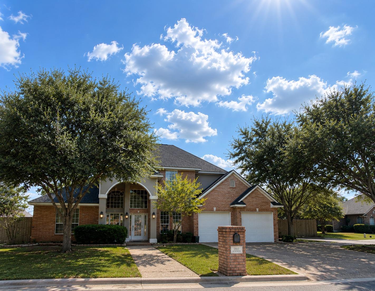 Classic brick architecture meets mature landscapi