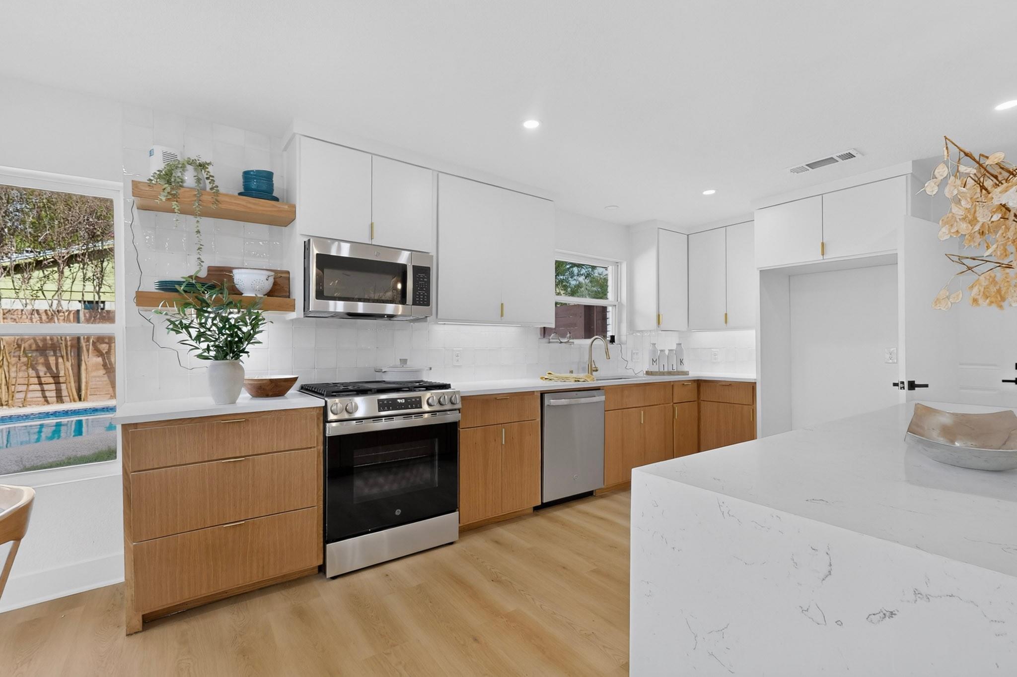 Warm wood accents complement minimalist cabinetry