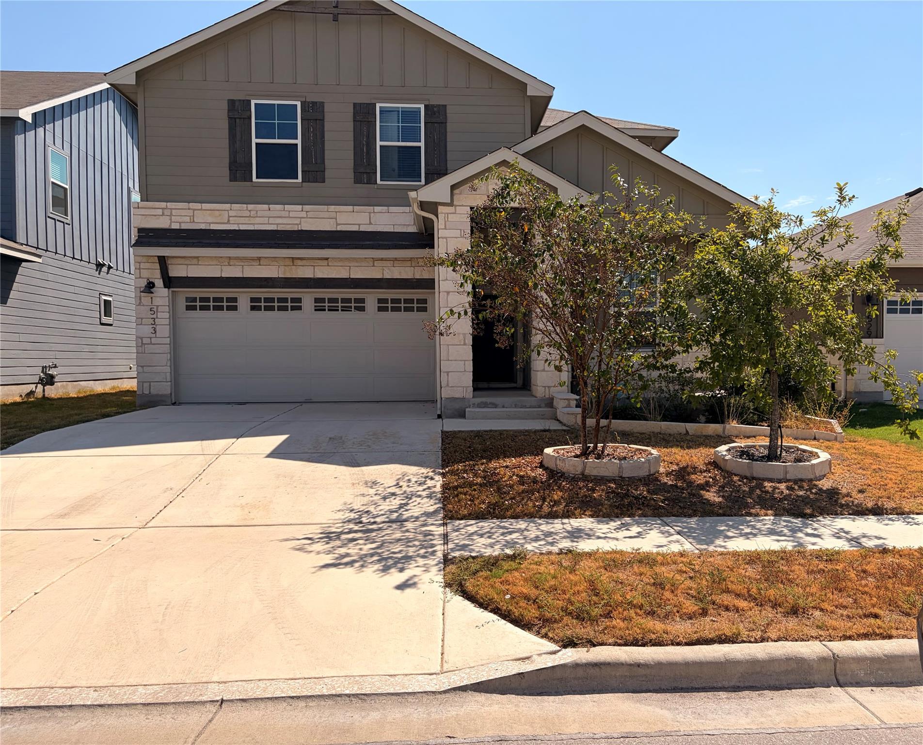 Attractive stone and siding accents define this t