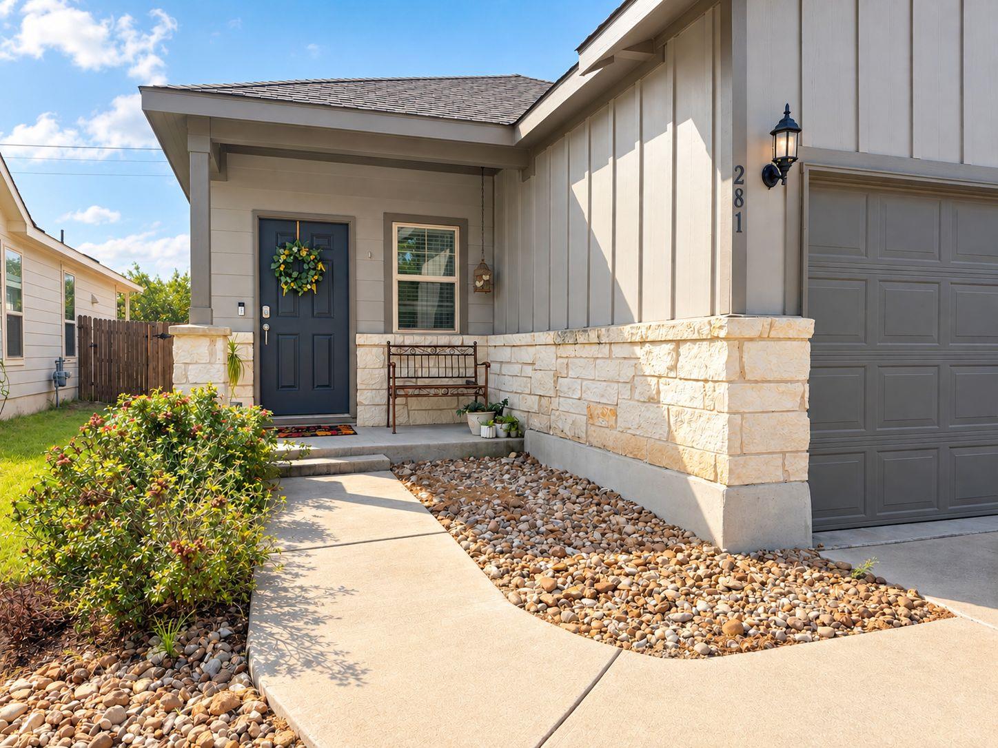 Welcoming front entrance showcases a curved concr