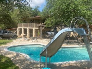 Mature trees shade a backyard retreat complete wi