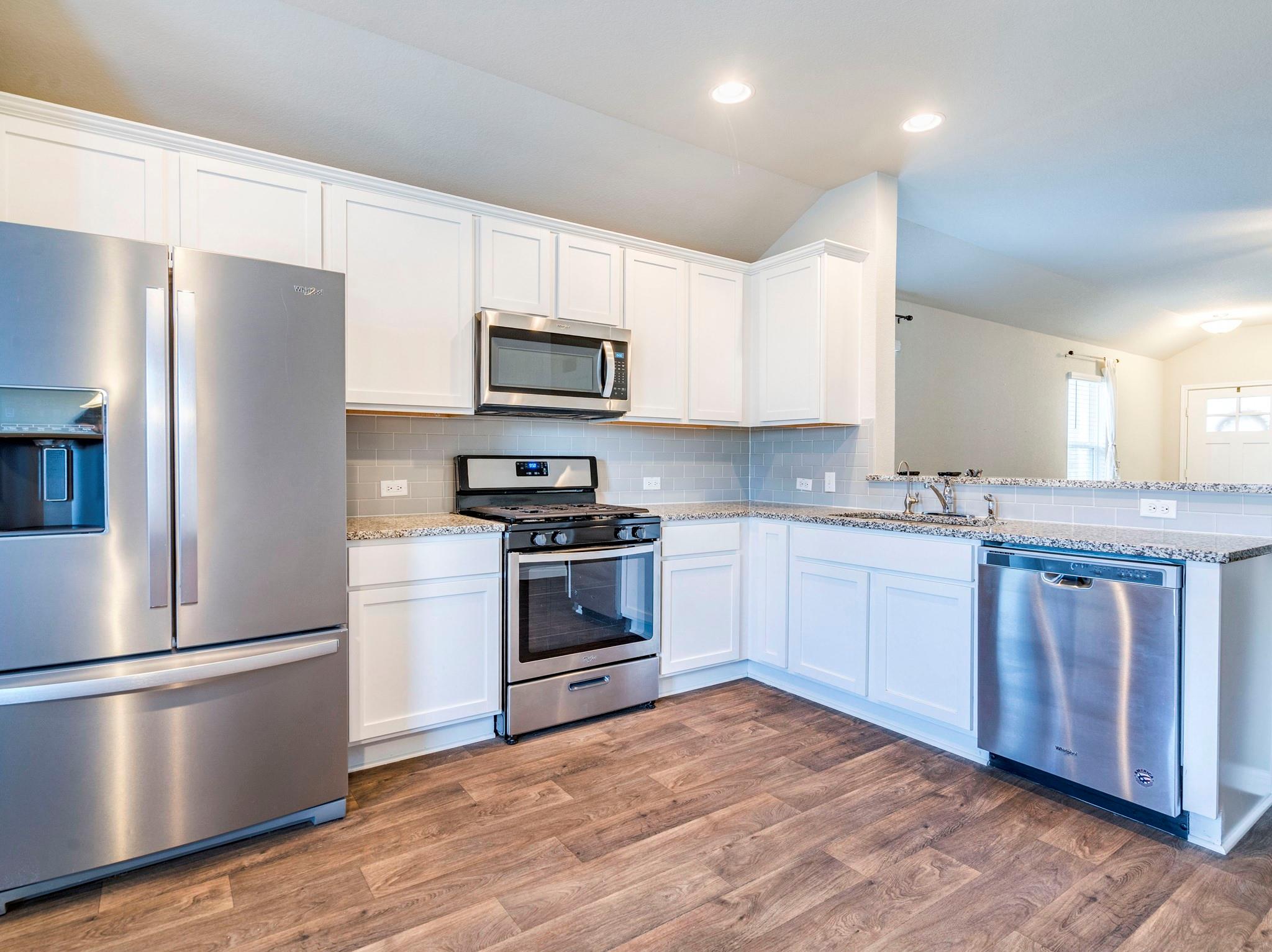 Rich wood flooring contrasts beautifully with cla