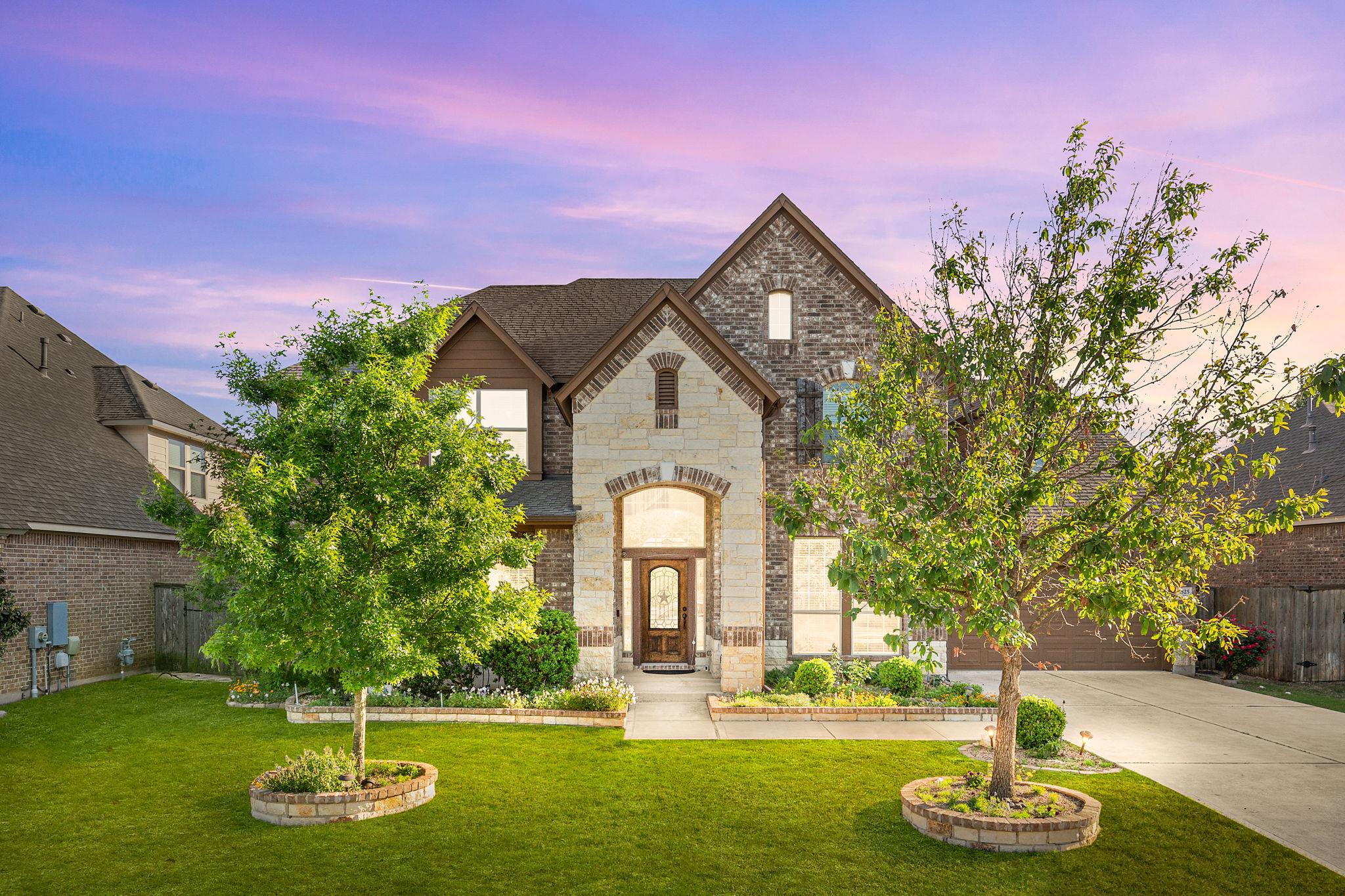 Stately brick and stone masonry defines this stri