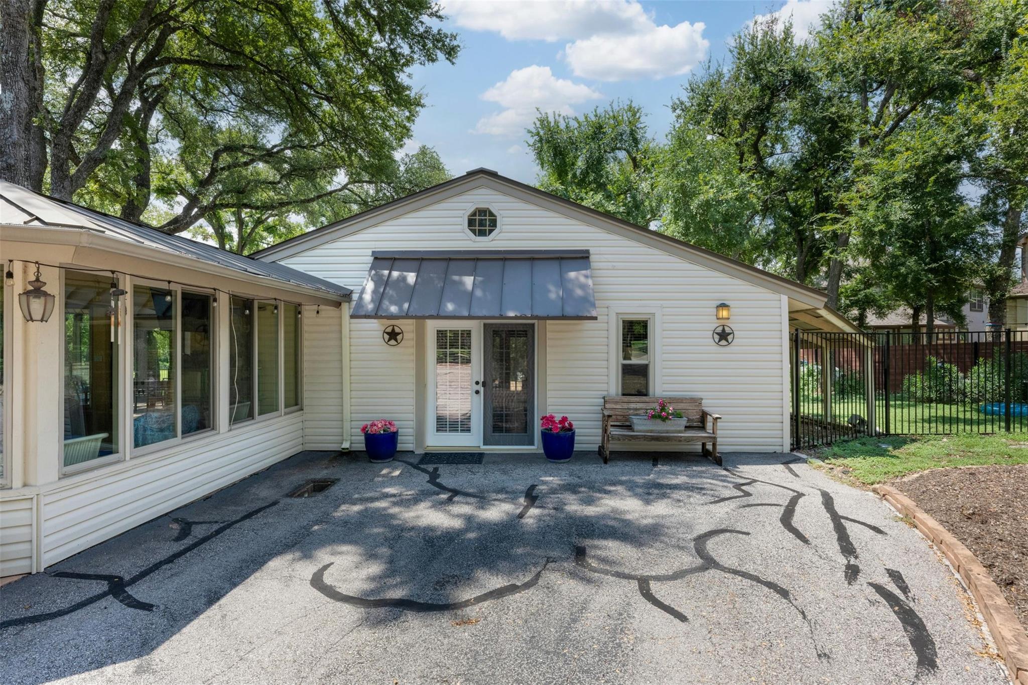 A well-maintained facade with a covered entry and