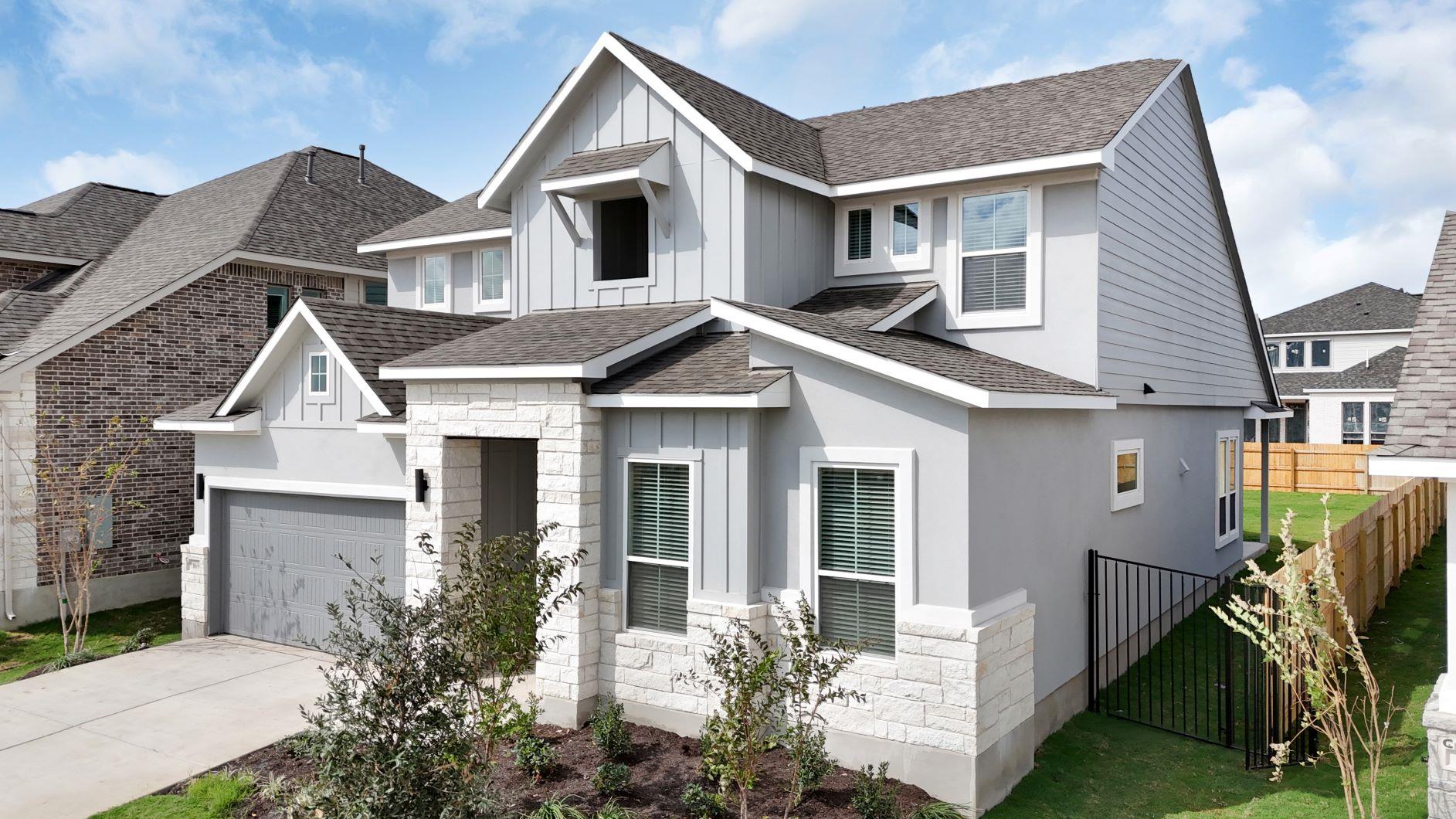 Crisp masonry accents and multi-textured siding c