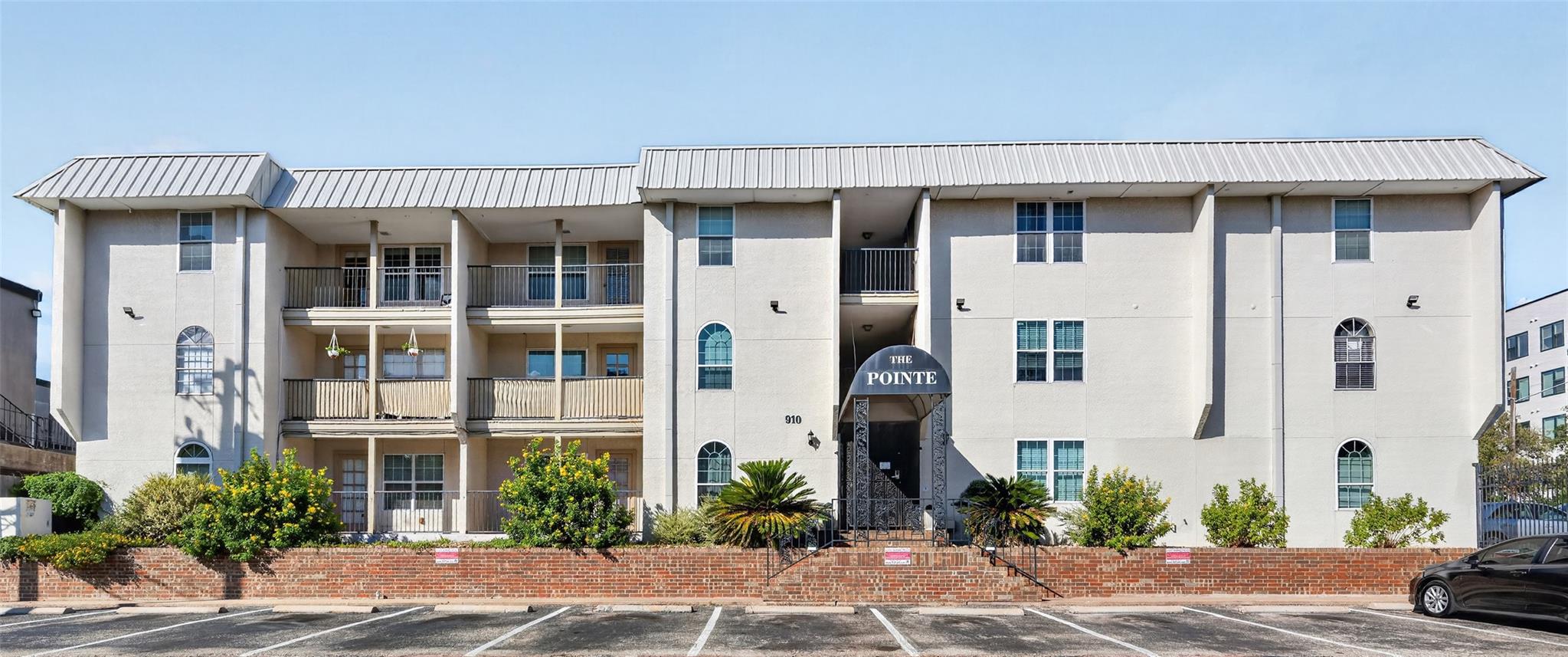 A classic multi-family building stands proudly be