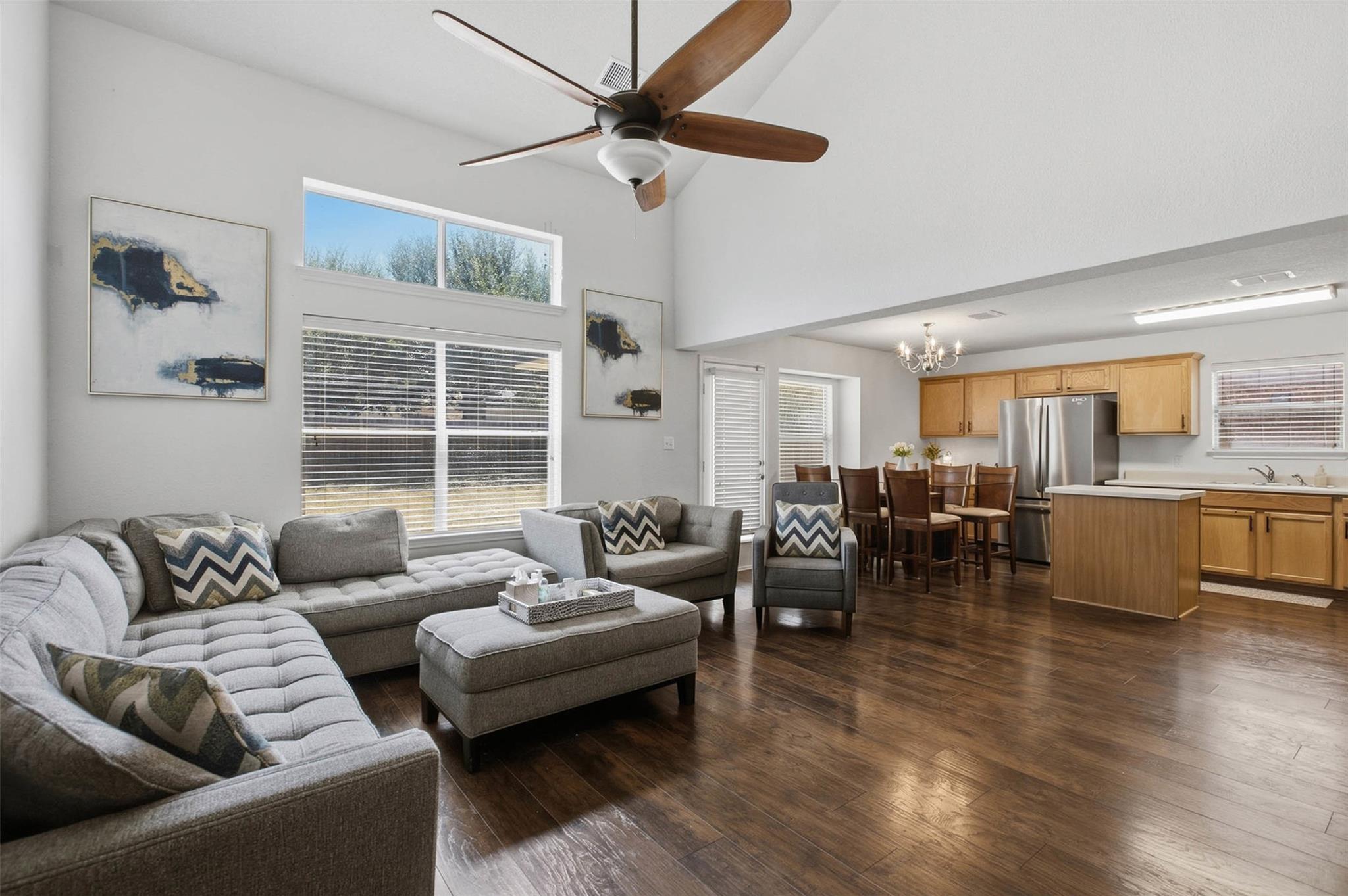Rich wood-inspired flooring and vaulted ceilings 