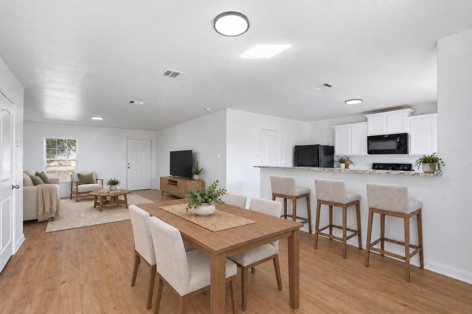 An open floorplan seamlessly connects the dining 