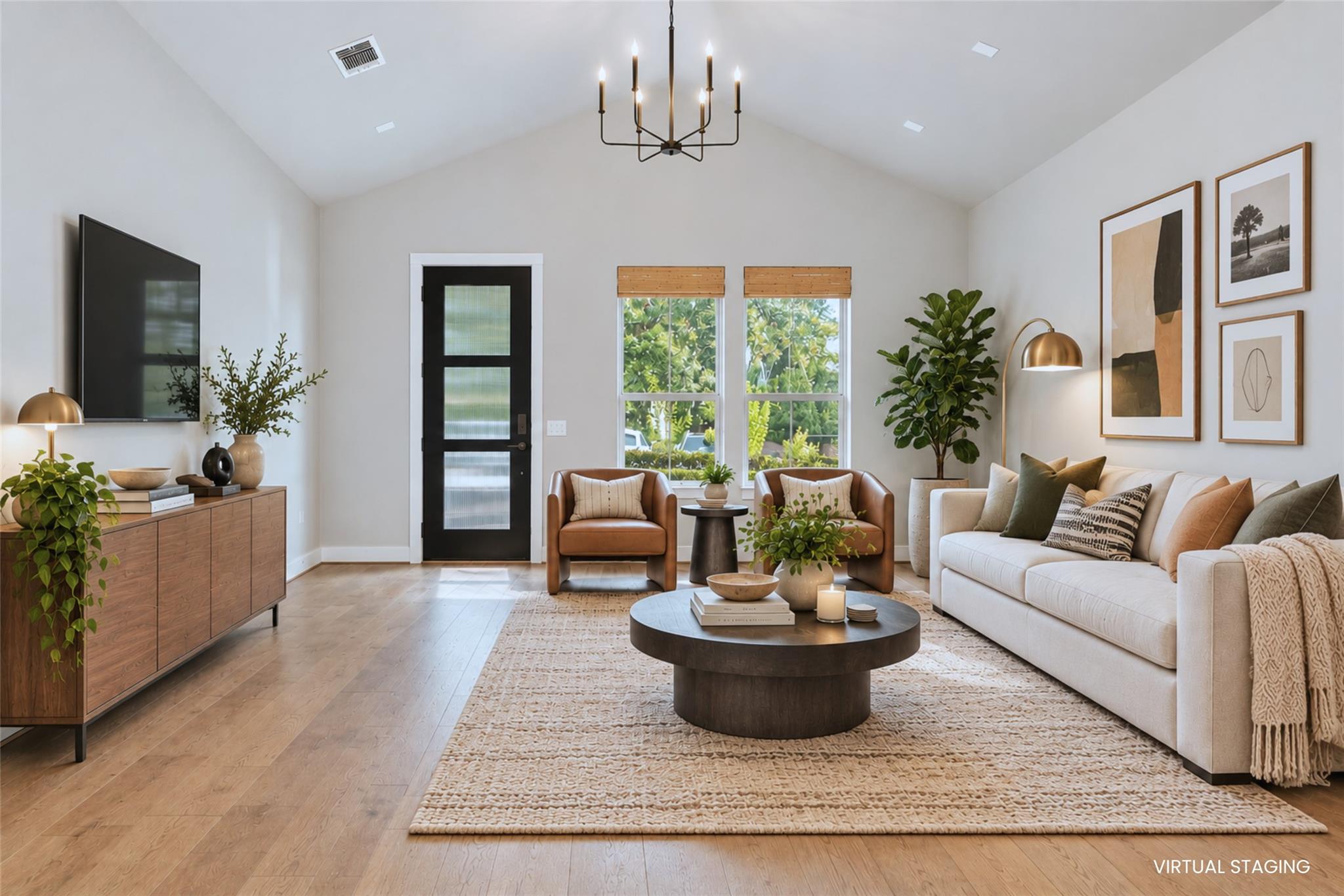 Vaulted ceilings and warm hardwood floors create 