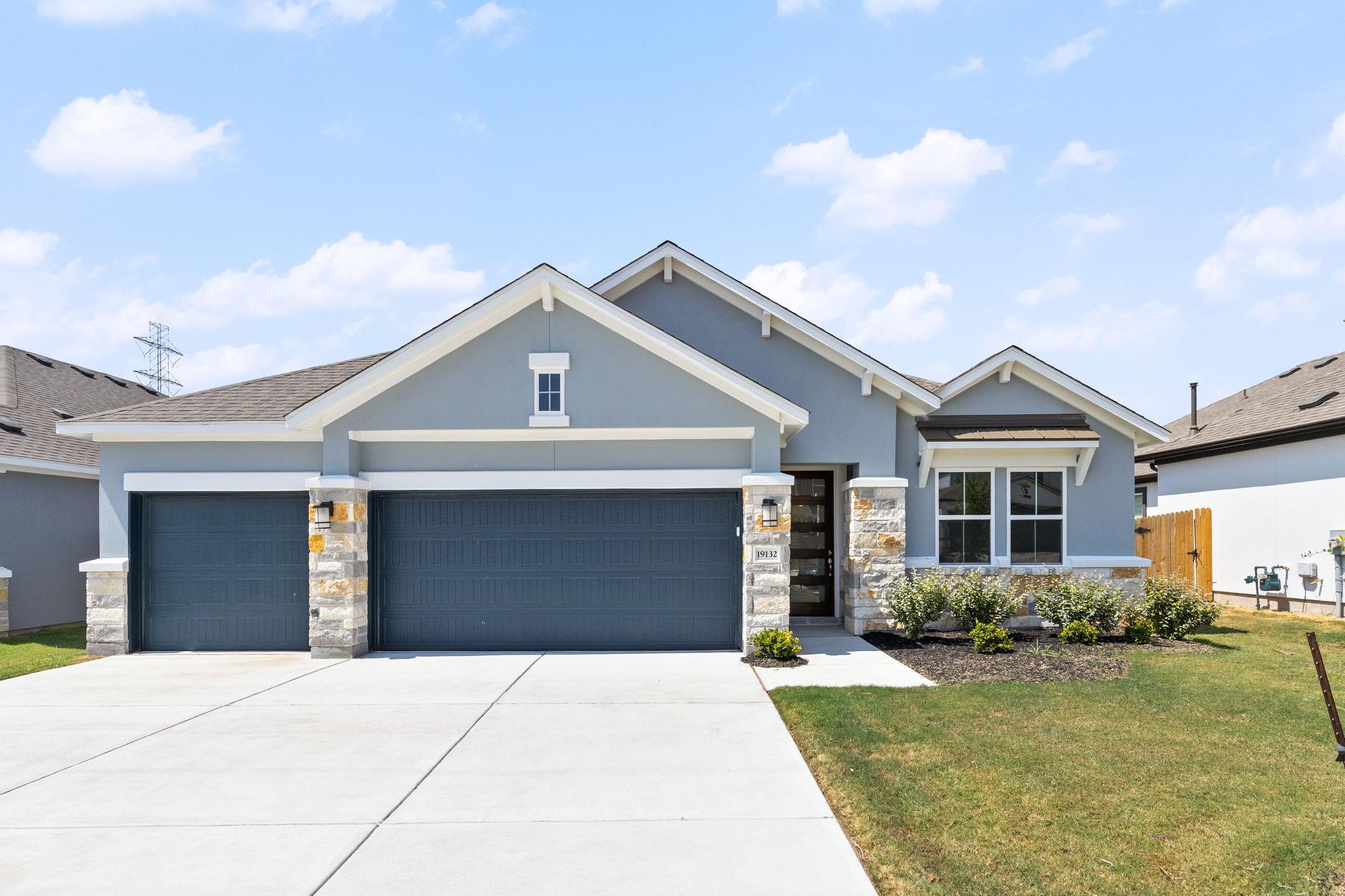 Clean architectural lines and modern stone accent