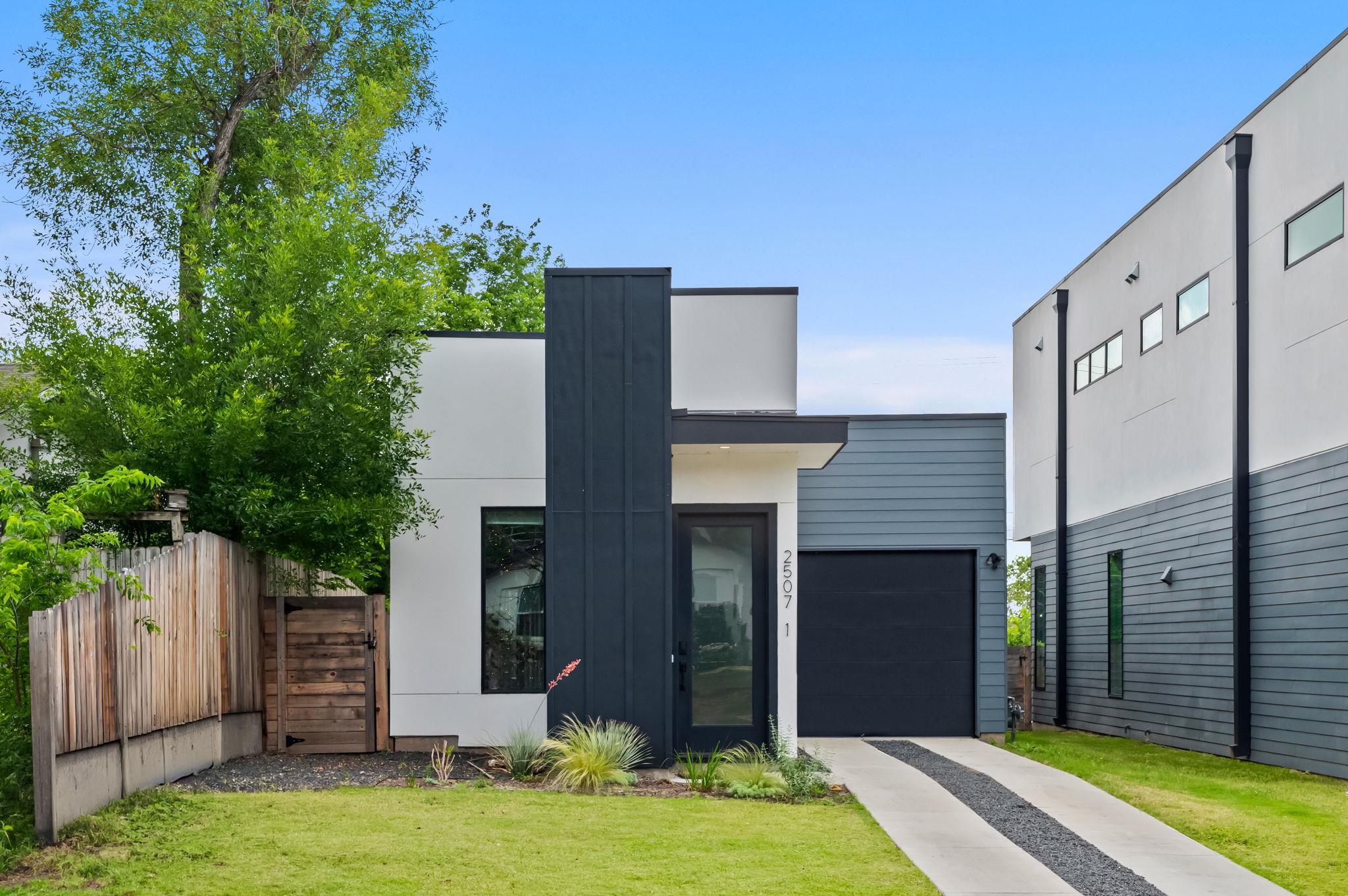 Modern facade featuring a dark gray panel accent,